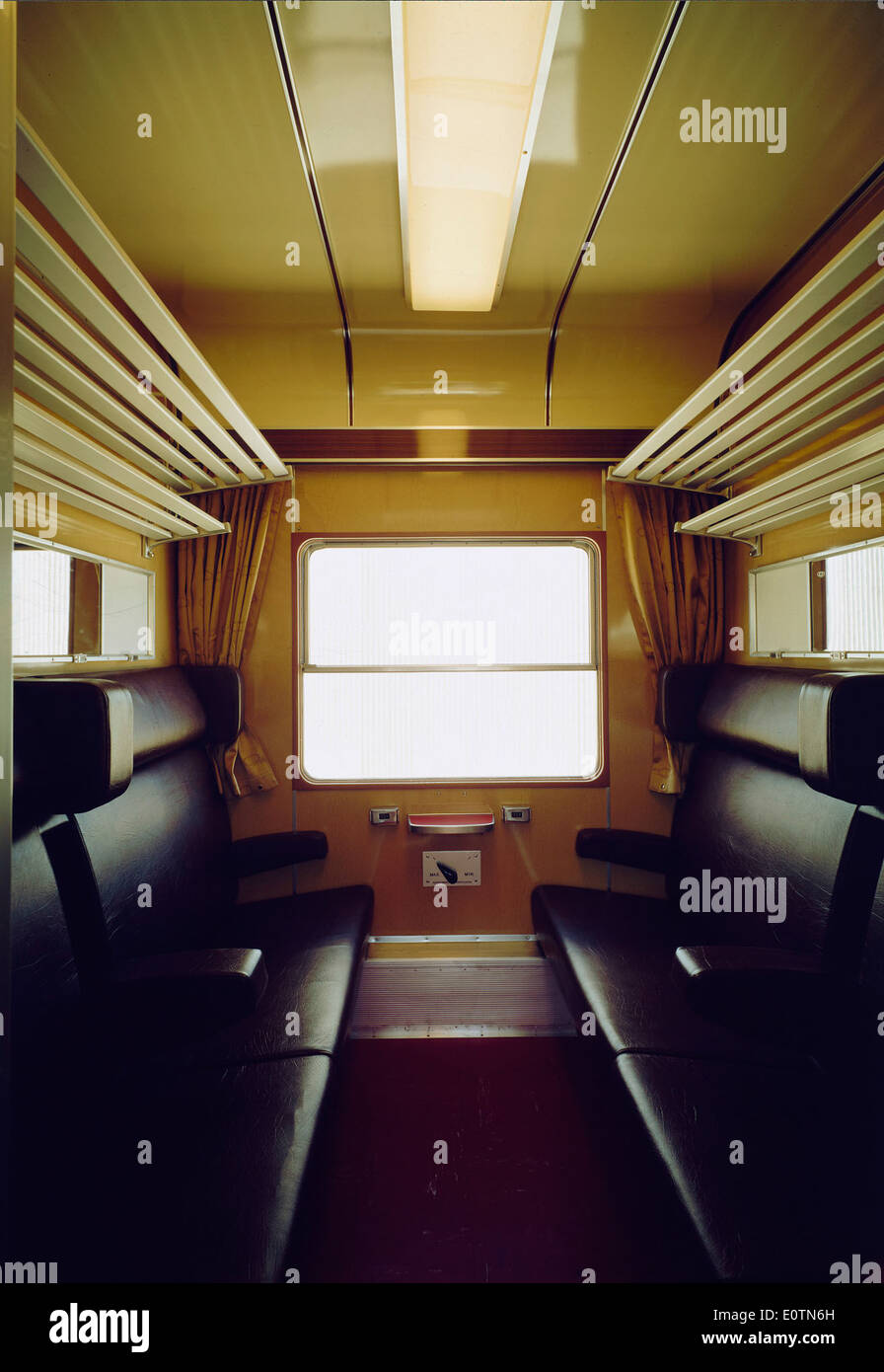 The interior of a carruagem (carriage) in Portugal represents the traditional form of transport used for long-distance travel. It showcases vintage transportation design and is part of Portugal's historical railway heritage. Stock Photo