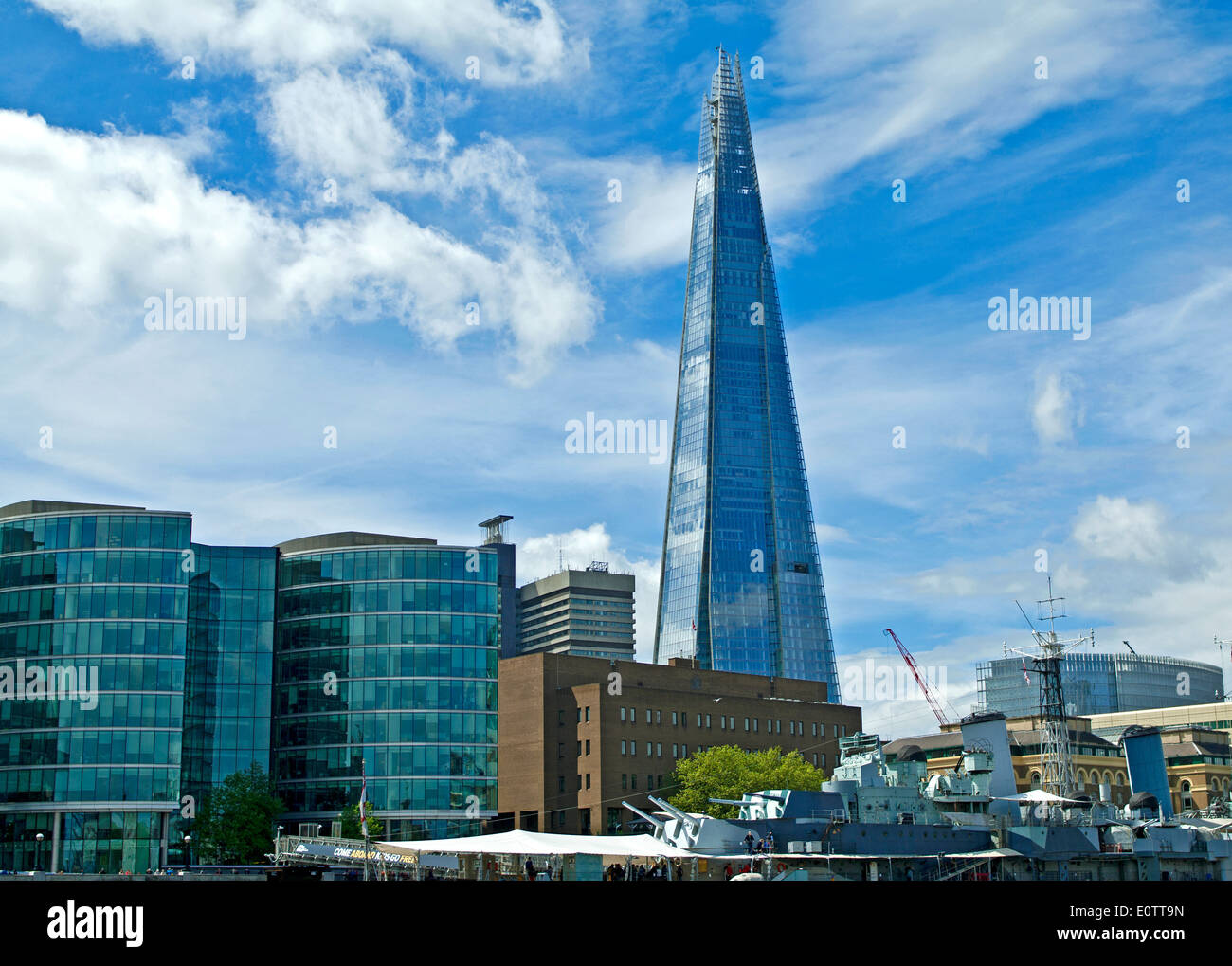 The Shard seen from the River Thames, with the warship museum 'HMS Belfast' moored in the foreground, central London, England UK Stock Photo