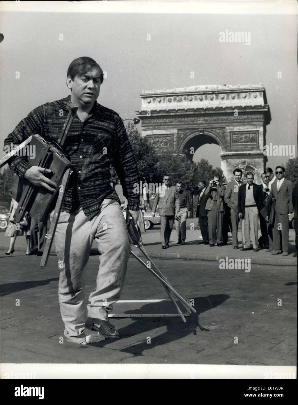 Sep. 12, 1960 - TV Funny-Man Tony Hancock goes arty in Paris. TV funny - man Tony Hancock was in Paris at the week-end acting in a scene for his new film ''The Rebel'' . In the film Tony plays an English clerk who runs away to Paris to become an artist. Photo shows Tony as the complete artist with board and easel on location near the Arc De Triomphe in Paris where he is filming ''The Rebel' Stock Photo