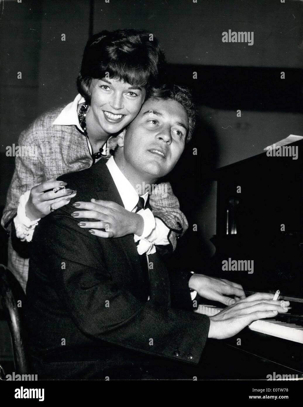 Aug. 08, 1960 - Sydney Chaplin and Dawn Addams Rehearse for new Film.: 34-year old actor, Sudney Chaplin, son the famous comedian, pictured with actress Dawn Addams in London yesterday, as they rehearse for the new film in which they star, ''Follow That Man' Stock Photo