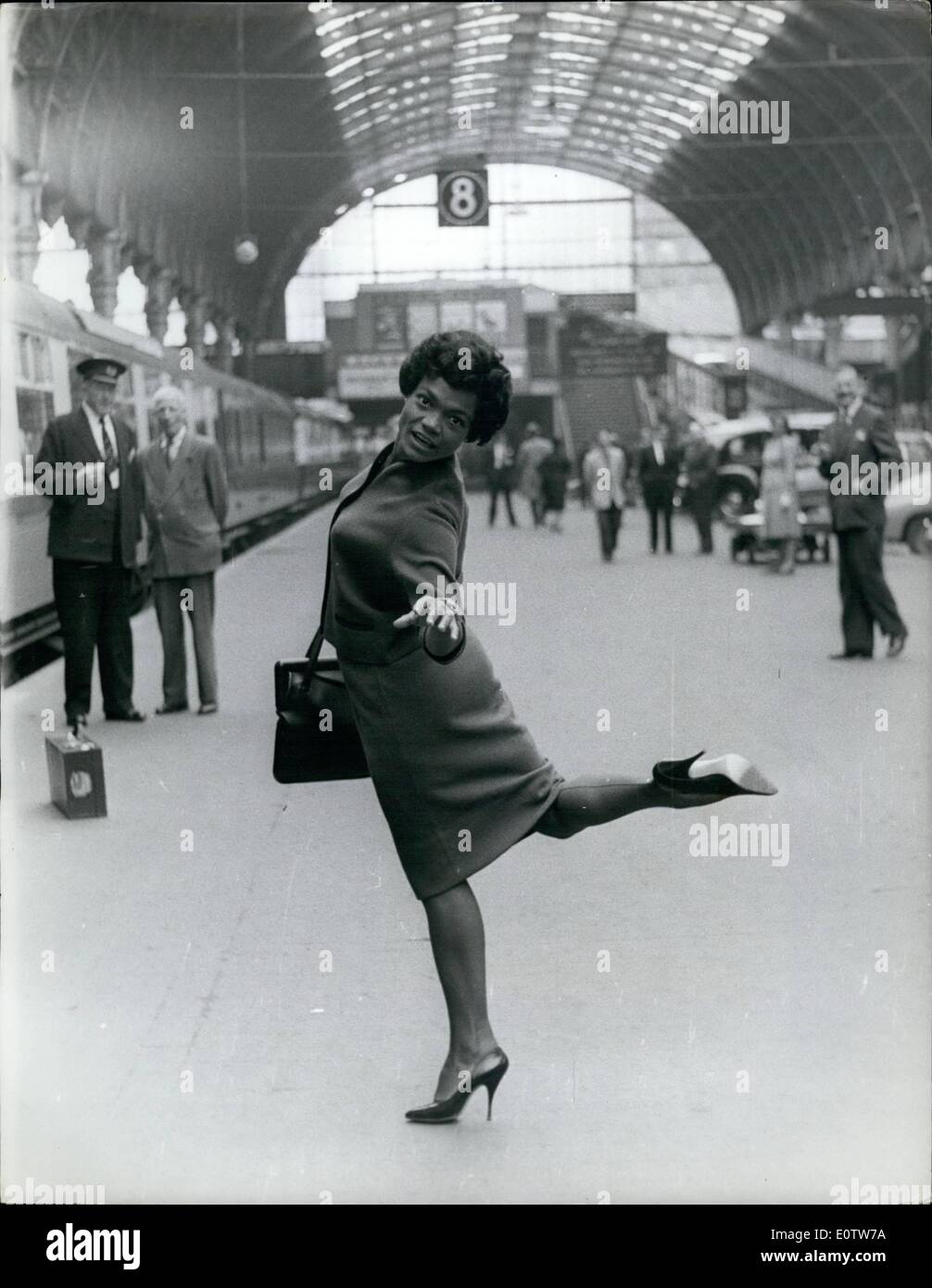 Aug. 08, 1960 - Eartha Kitt Arrives In London With Her Husband Of Three Months: Eartha Kitt, the singer whose purring notes bring out the ay dog in most men, arrived in London yesterday accompanied by her husband of three months, Hollywood real-estate man Bill McDonald. Eartha who is here for a two-month cabaret season, says she hope to become an expectant mother while in London. Photo shows Eartha Kitt is in high spirits when she arrived at Paddington Station yesterday. Stock Photo