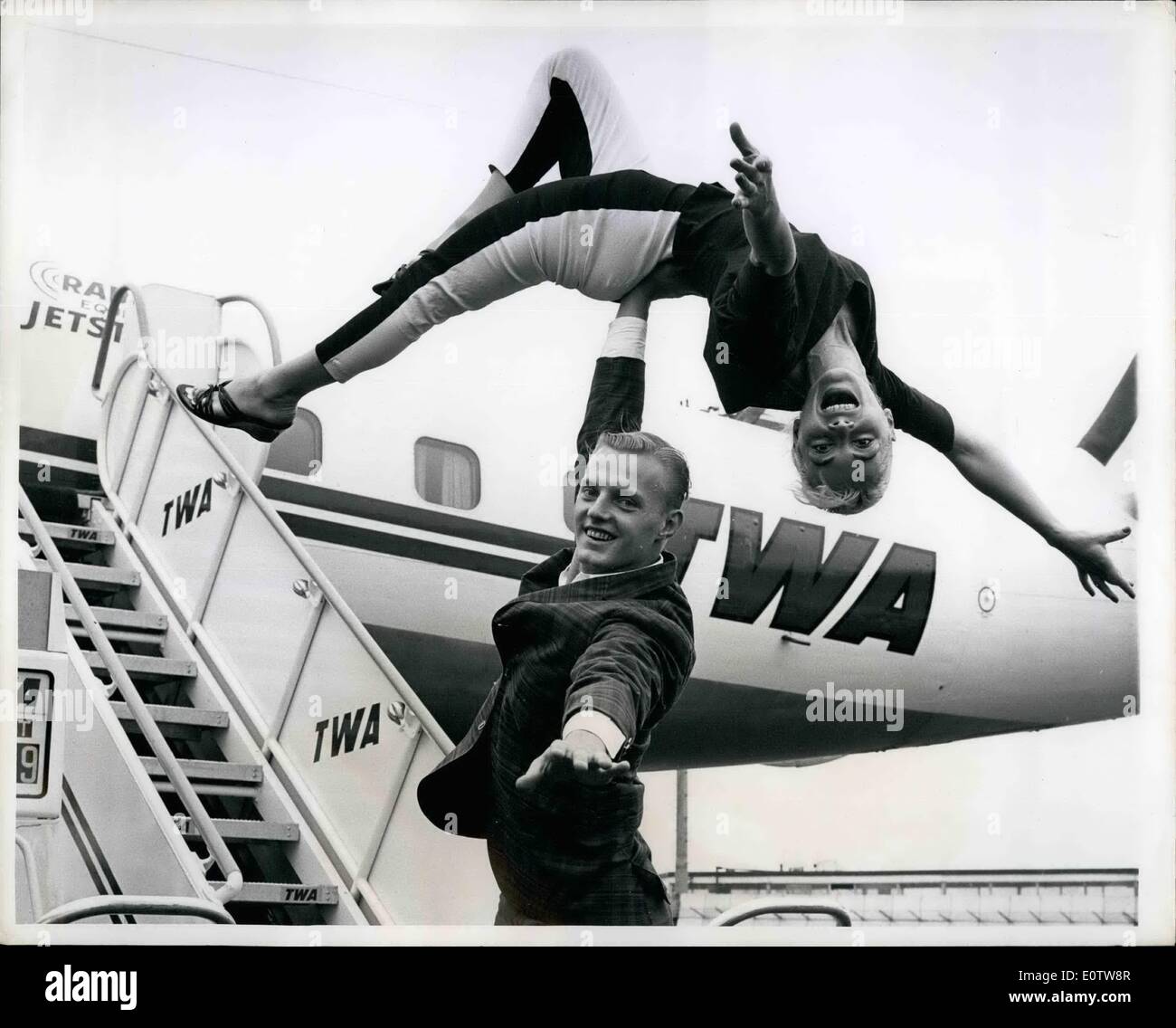 Aug. 08, 1960 - La guardia airport, august 22,1960. adagio dancers Paris and clair seem to soar through the air inspired by their flight from las Vegas via TWA, the superjet airline. the popular entertainers returned from a successful engagement in the popular gambling resort. Stock Photo