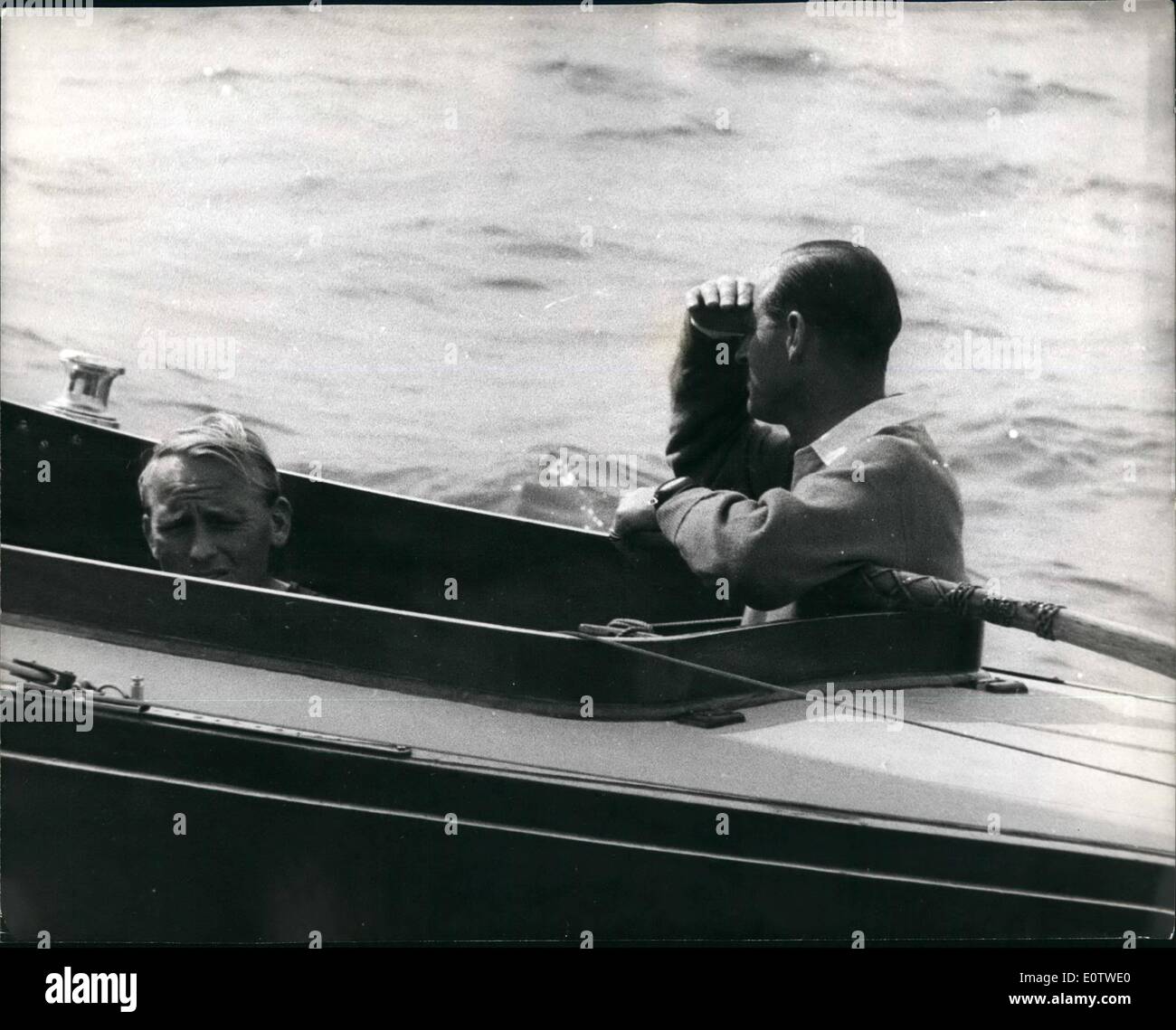Aug. 08, 1960 - Cowes Yachting Week, Duke Goes Racing in Bluebottle . Keystone Photo Shows: The Duke of Edinburgh shades his eyes as he looks out to sea, while racing at Cowes today aboard this Dragon yacht BluebottleÃ Stock Photo