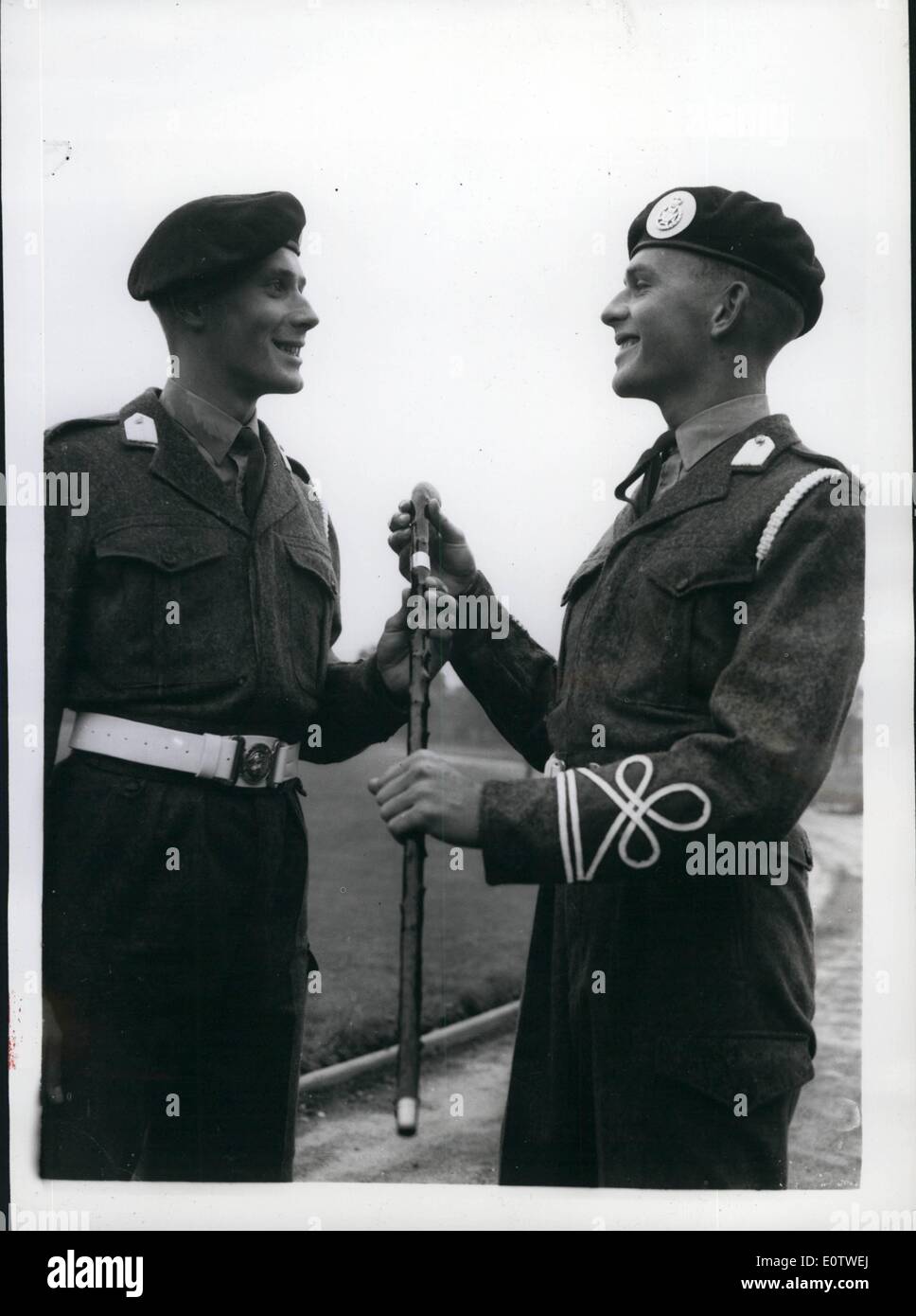 Aug. 08, 1960 - Monty Takes Commissioning Parade At Aldershot Twin Brothers Take Part: Field Marshal Viscount Montgomery this morning took the Commissioning Parade of the Mons Officer Cadet School - at Aldershot.Photo Shows Senior under officer P.R. Duffel (right) - with his Silver Mounted Stock as the 'Best Cadet' and his twin brother Junior under officer M.R. Duffel - after the passing out parade at Aldershot this morning. They were born in 1939. Stock Photo