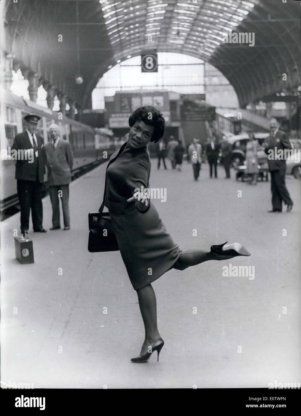 Aug. 08, 1960 - Eartha Kitt Arrives In London With Her Husband Of Three Months: Eartha Kitt, the singer whose purring notes bring out the gay dog in most men, arrived in London yesterday accompanied by her husband of three months Hollywood real-estate men Bill McDonald, Eartha, who is here for a two-months cabaret season, says she hopes to become an expectant mother while in London. Photo Shows Eartha Kitt is in high spirits when she arrived at Peddington Station yesterday. Stock Photo