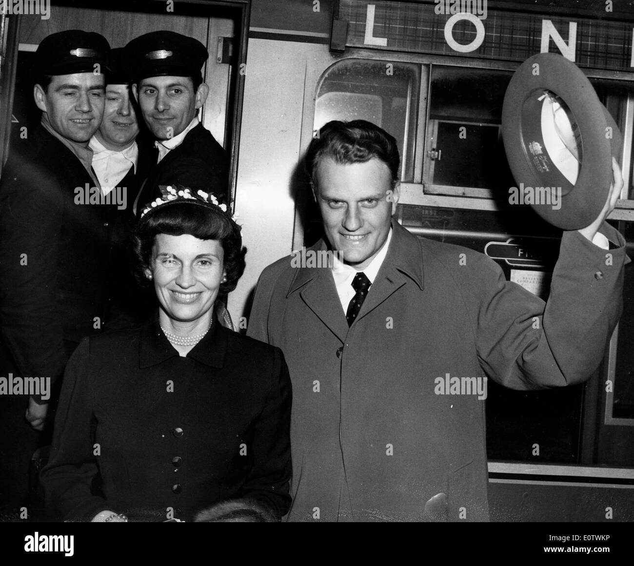 Billy Graham and wife Ruth wave as they arrive Stock Photo