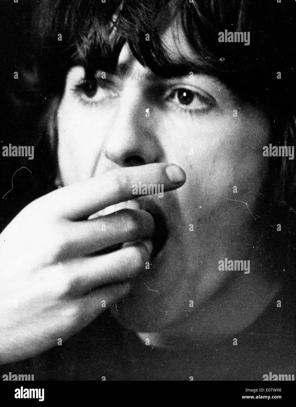 Close-up of Beatle George Harrison eating Stock Photo