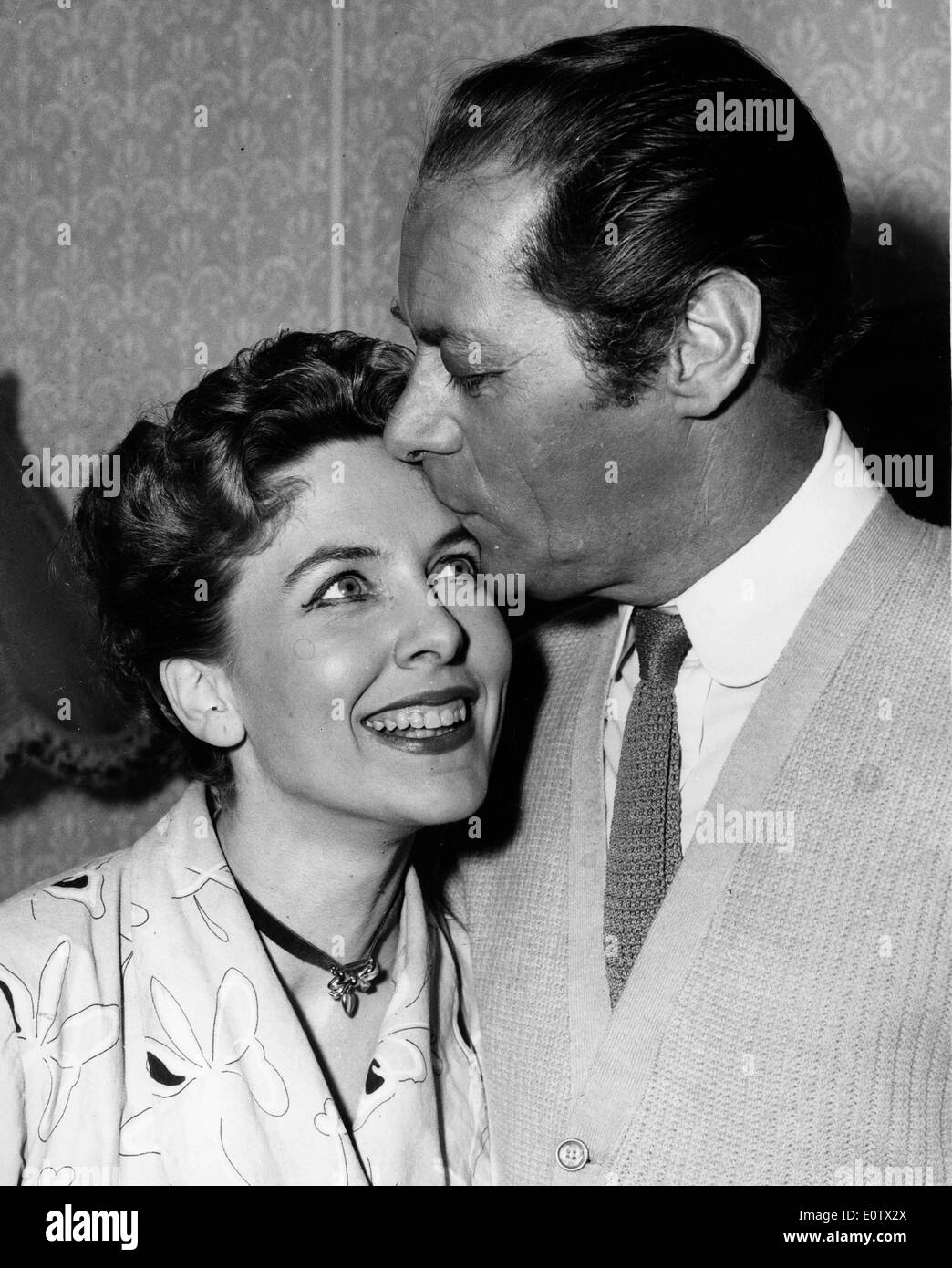 Actor Rex Harrison kisses wife Lilli Palmer Stock Photo