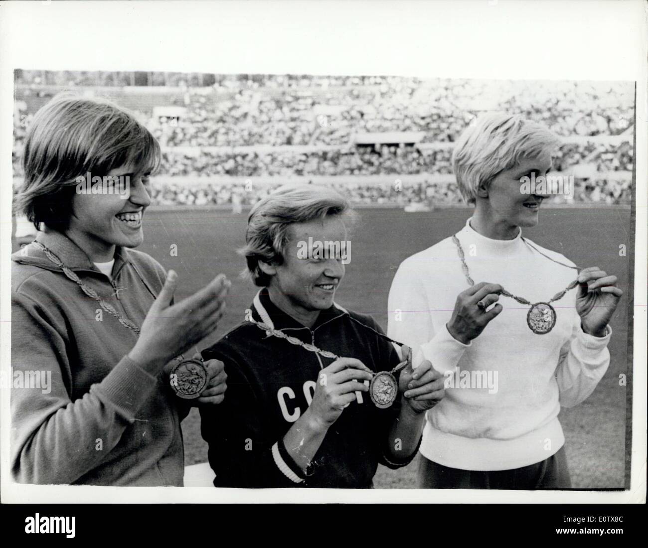 Sep. 01, 1960 - Olympic Games In Rome. Men's 100 Metres Heats Event. Photo shows V. Krepkina, of Russia, pictured in centre with her Gold Medal, after winning the Women's Olympic Long Jump in Rome yesterday. On left is H. Claus (Germany), with her bronze medal and on right is E. Krzesinska, of Poland, with her silver medal. Stock Photo