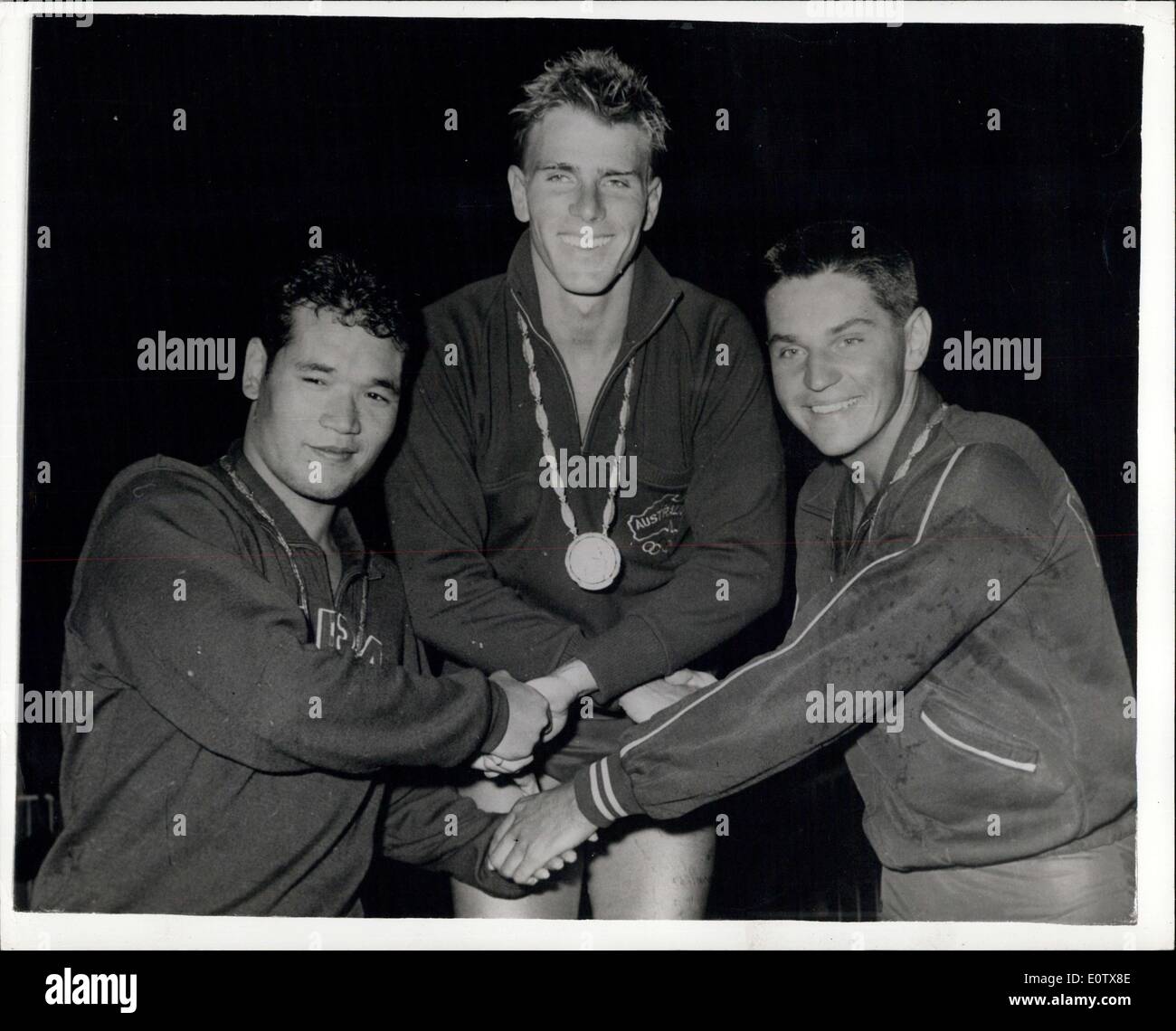 Sep. 01, 1960 - Olympic Games in Rome. Murray Rose wins Gold Medal for Australia. Murray Rose of Australia, created a new Olympic record of 4 mins. 18.3 secs, when he won the final of the men's 400 Metres freestyle event, in Rome last night. T. Yamanaka of Japan was second, and J.Konrads, of Australia , was third. Photo shows Hands shake all round after receiving their medal for M.Rose (centre) , Gold Medal ; T.Yamanaka (left), Silver medal , and J.Konrads, (right), Bronze Medal. Stock Photo