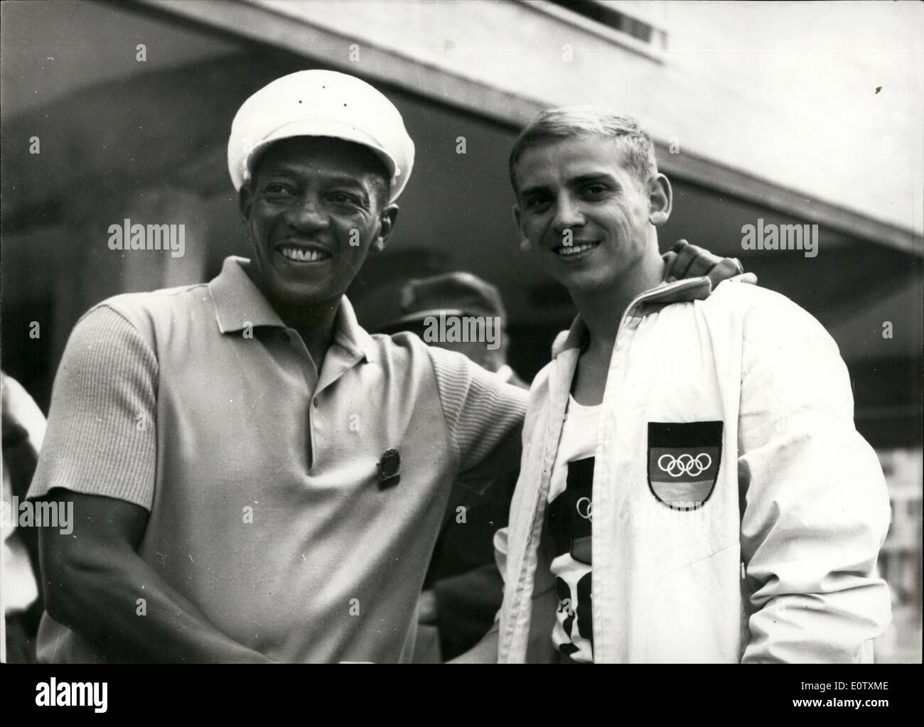 Sep. 09, 1960 - The 1960 Olympic Games In Rome. The Old Champion Meets The New. Photo Shows:- Former Olympic champion Jesse Owens (left) is seen chatting to Armin Hary, of Germany, yesterday's gold medal winner of the 100 metres in Rome. Stock Photo