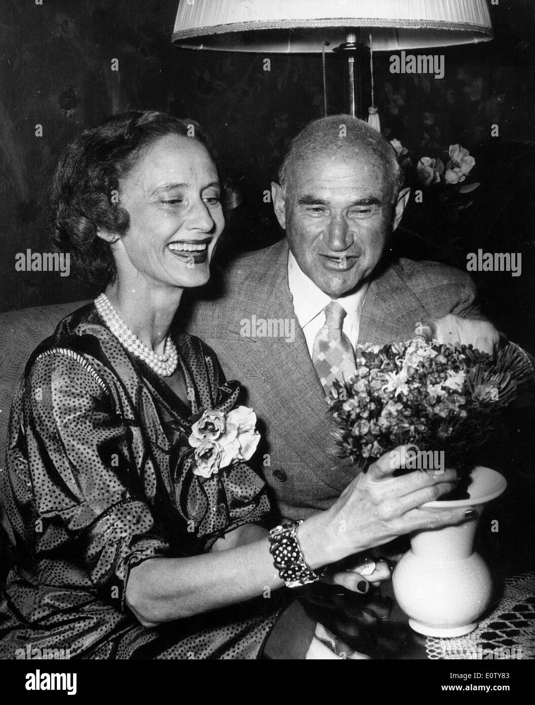 Samuel Goldwyn giving his wife Frances Howard flowers Stock Photo ...