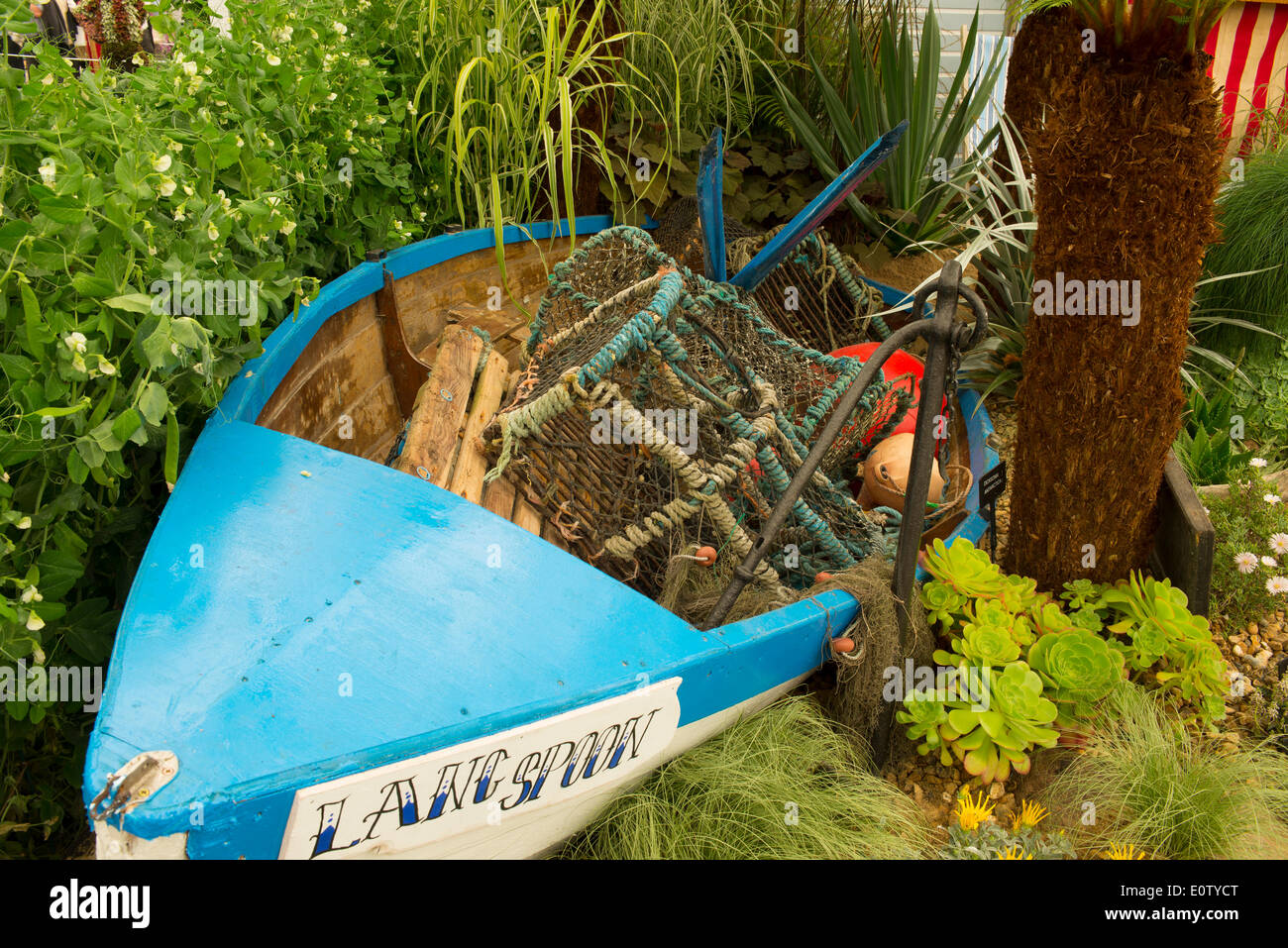 London, UK, 19th May, 2014. RHS Chelsea Flower Show sponsored by M&G. Fifty Years of Bloom in the South West, a nostalgic garden with four aspects in the Great Pavilion by Jon Wheatley. Credit:  Malcolm Park editorial/Alamy Live News Stock Photo