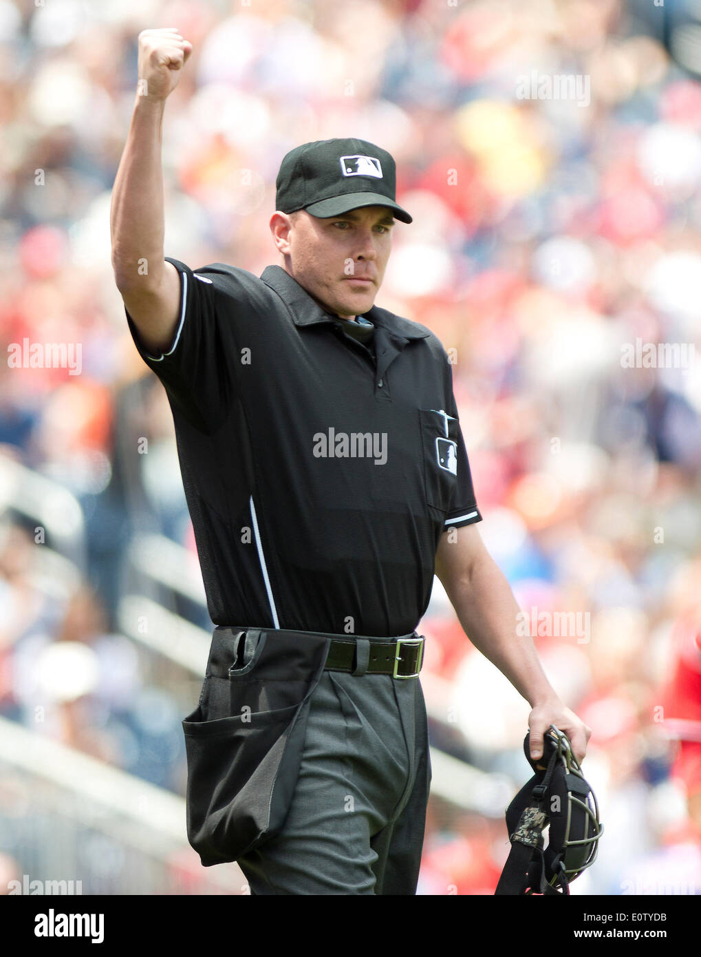 Home plate umpire Jon Byrne (59) signals an out in the first inning of