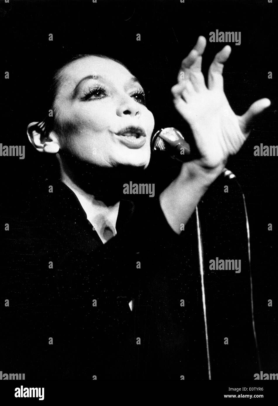 Singer Juliette Greco singing during a performance Stock Photo