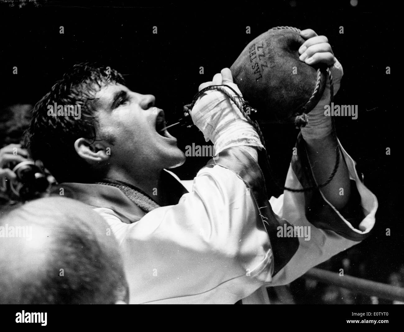 Boxer Johnny Gonsalves takes a drink after a match Stock Photo