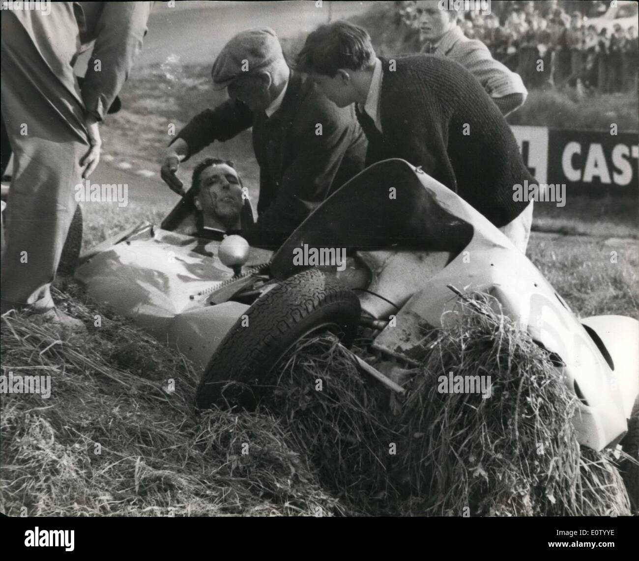Oct. 10, 1960 - Racing driver's steering wheel game off; Racing driver, Dennis Taylor was driving his Lols racing car into Draid's Corner at 70 miles an hour when the steering wheel came away in his hand. He braked herd at the bottom of ''flat-out'' Davids Hill, during the last meeting of the season at Brand's Hatch, yesterday, and swung into the band. Above the roar of his engine, spectators heard the snap as the leather bound wheel sheared from its mounting. Man and women ran for the lives as the car plounged into a bank Stock Photo