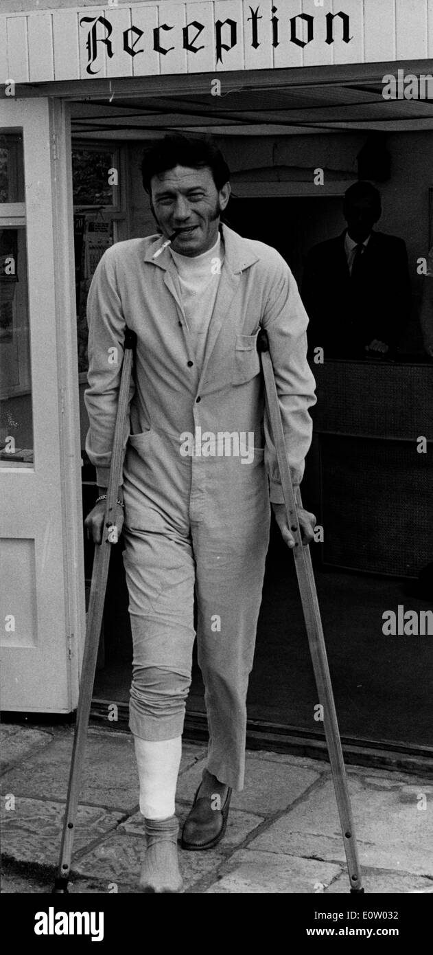Actor Laurence Harvey walking around on crutches Stock Photo