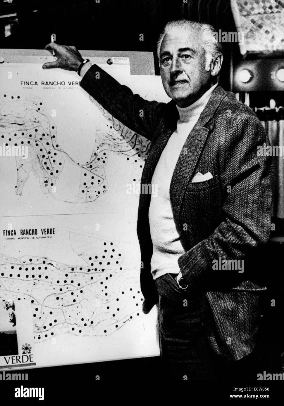 Actor Stewart Granger going over a map Stock Photo