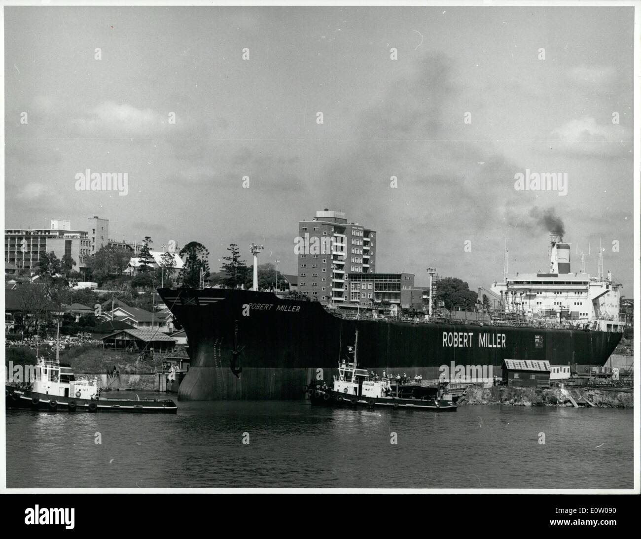 Oct. 10, 1960 - Tugs manoeuvre around the Australian-built tanker Robert Miller after its launching at Brisbane in October, 1973. Australian Information Service Photograph Industry - Shipbuilding Stock Photo