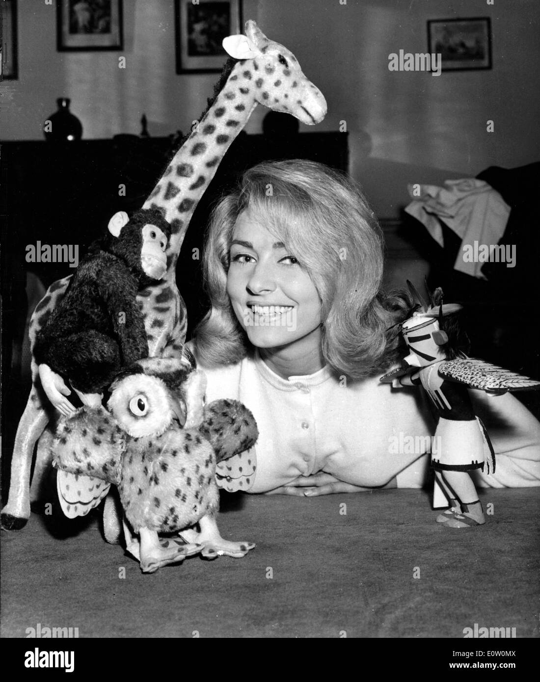 Actress Elga Andersen at home with toys she bought in Brazil Stock Photo