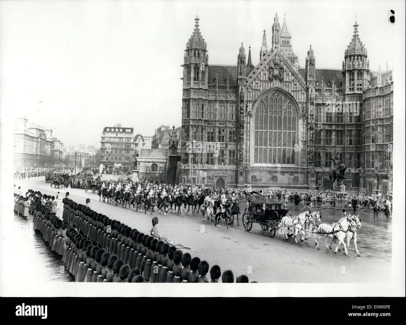 Nov. 01, 1960 - State Opening Of Parliament. Queen Arrives At Palace Of Westminster. Photo shows The scene as the Guards Officer dips the colours in salute - as the Irish State Coach carrying the Queen and Prince Philip approaches the Palace of Westminster for the State Opening of Parliament this morning. Part of Westminster Abbey can be seen in rear. Stock Photo