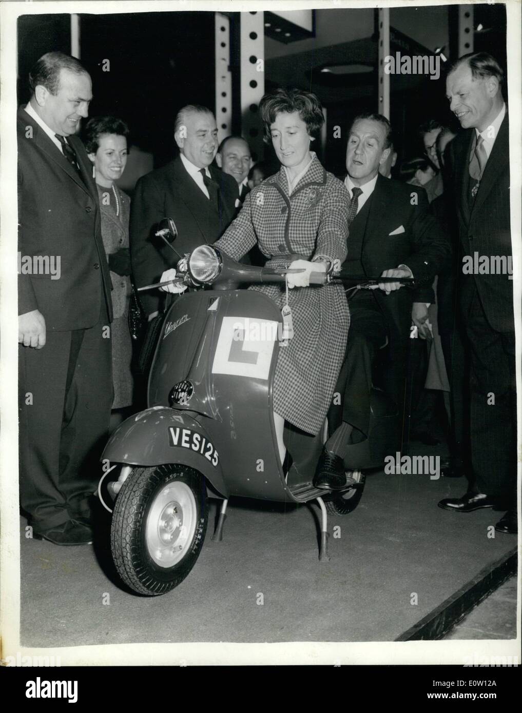 Nov. 11, 1960 - Mr. Marples opens the Motor Show.: Mr. Ernest Marples the Minister of Transport, today opened the Earls Court Motor Cycle Show. Photo shows Mr. Ernest Marples and his wife try out a Duel Controlled Vespa for learners, at This motor cycle has the conventional handle bars at the front plus an extra pair for the instructor, at Earls Court this morning. Stock Photo