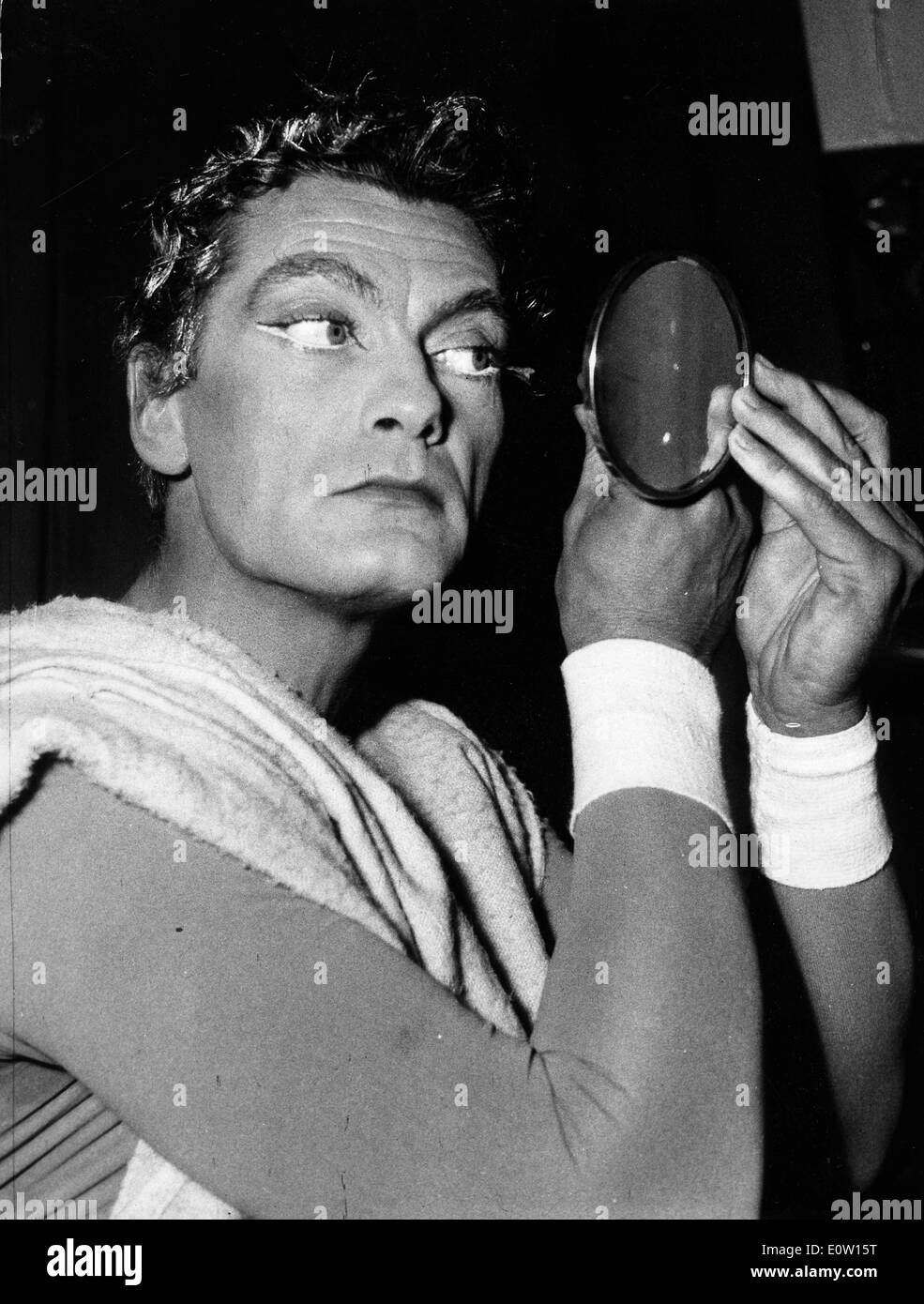Actor Jean Marais getting into costume for a film Stock Photo
