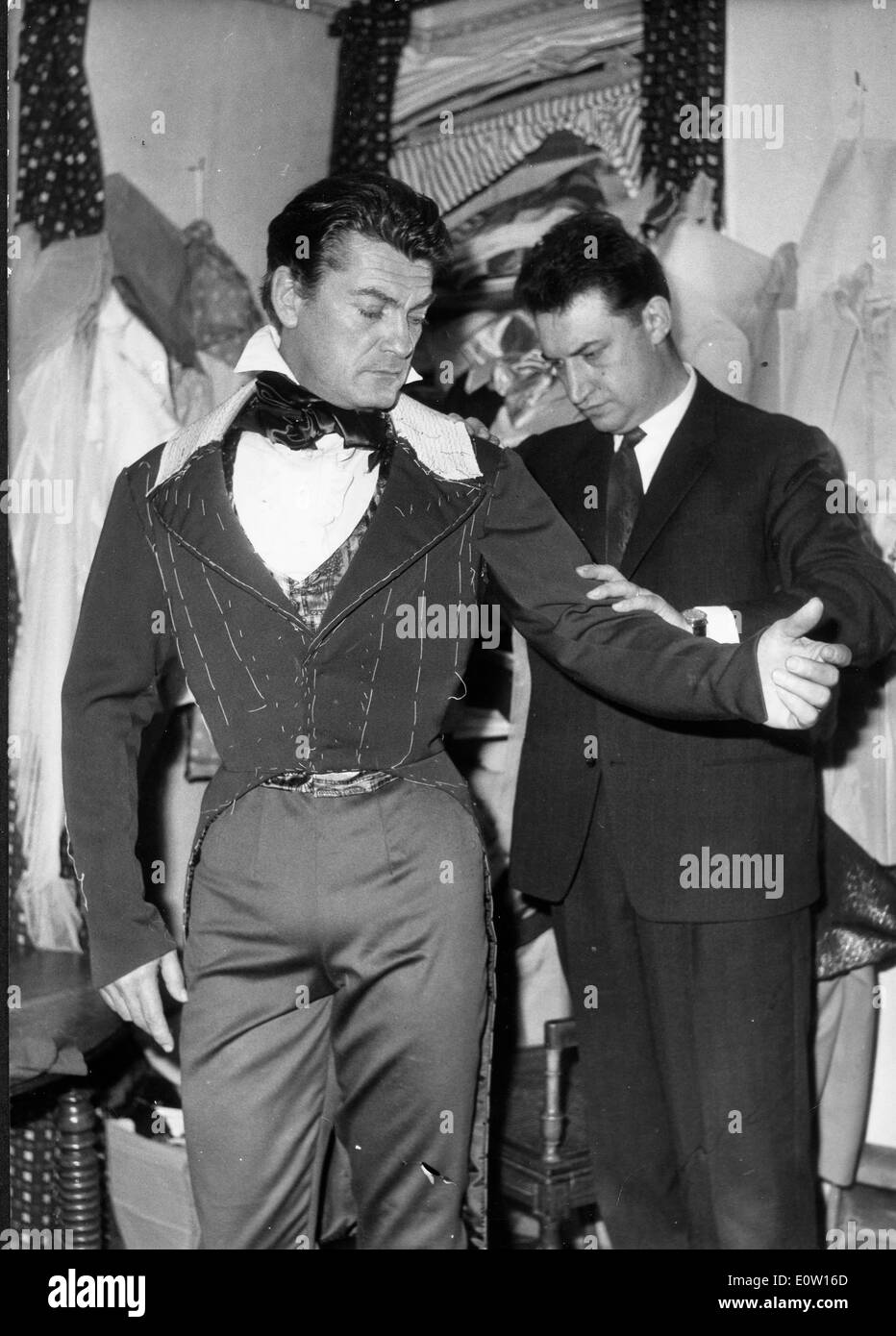 Actor Jean Marais getting fitted in a costume Stock Photo