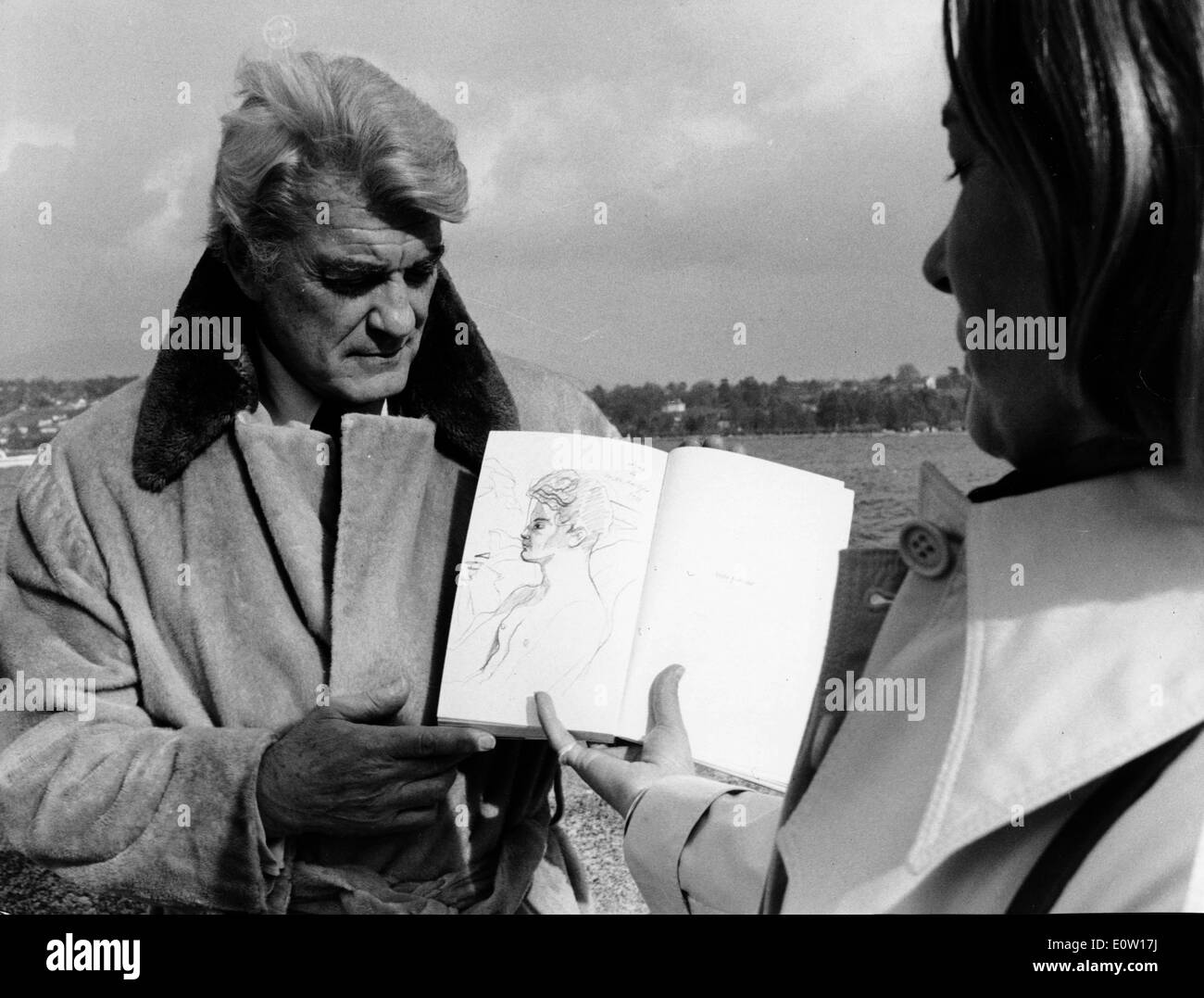 Jean Marais being sketched by an artist Stock Photo
