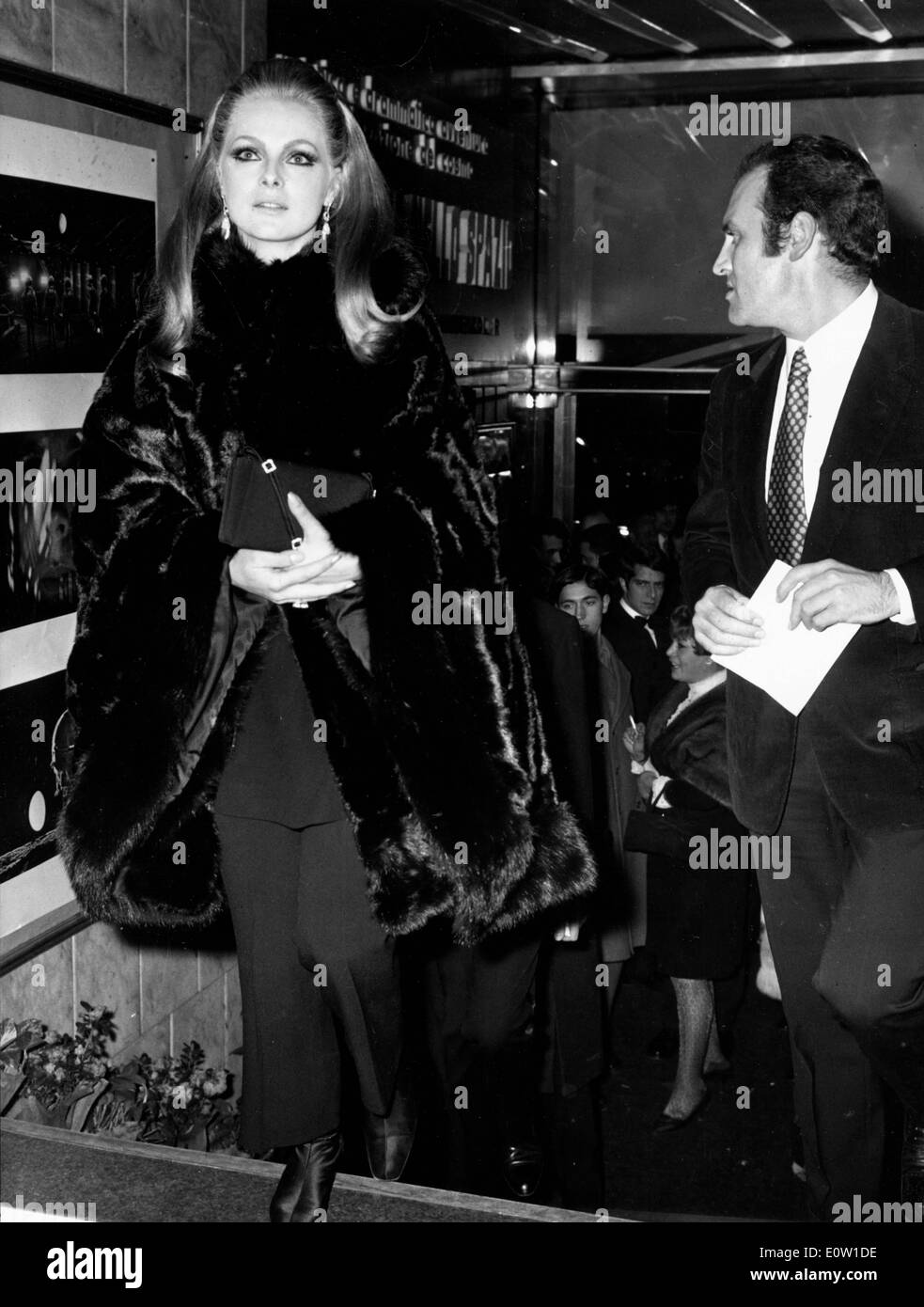 Actress Virna Lisi arriving at an event with her husband Franco Pesci Stock Photo