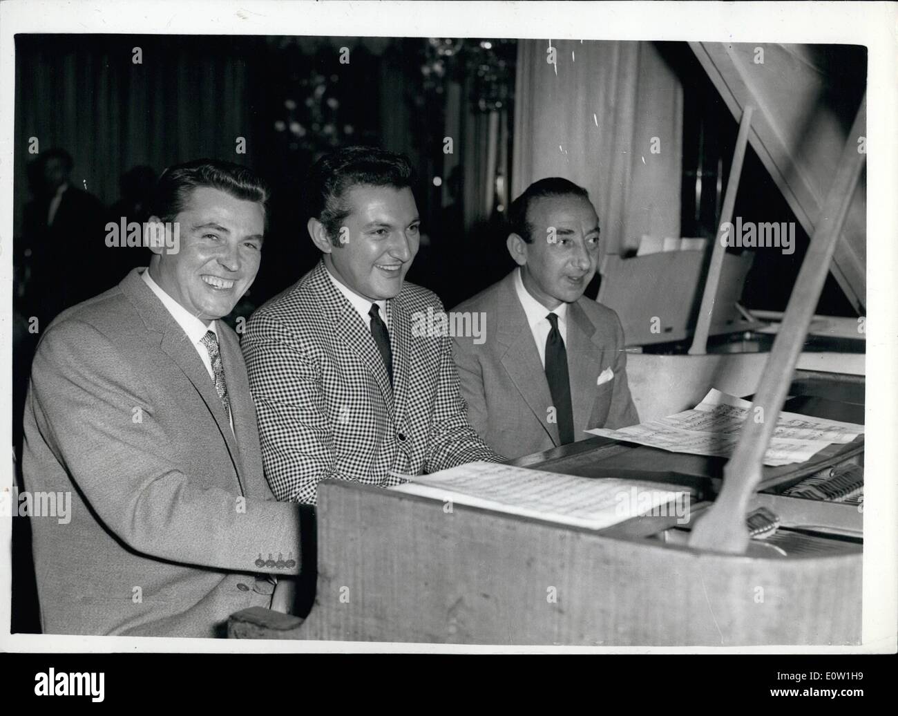 Nov. 11, 1960 - Recording Stars at Variety Club's 'Golden Disc' Luncheon. Many Top British and American recording stars attended today's Variety Club's annual 'Golden Dic' luncheon at the Dorchester Hotel. Keystone Photo Shows: Pictured on one piano at the luncheon today are (L to R): pianist composer, Russ Conway, American pianist Liberace and conductor composer, Stanley Black. Stock Photo