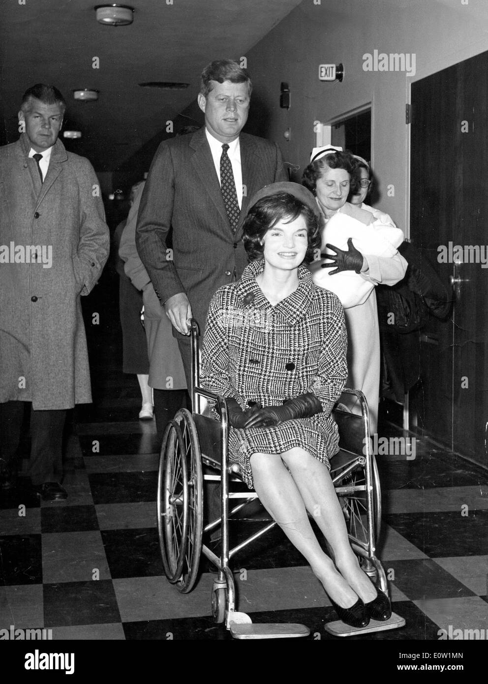 President Kennedy and Jackie leaving hospital with baby Stock Photo