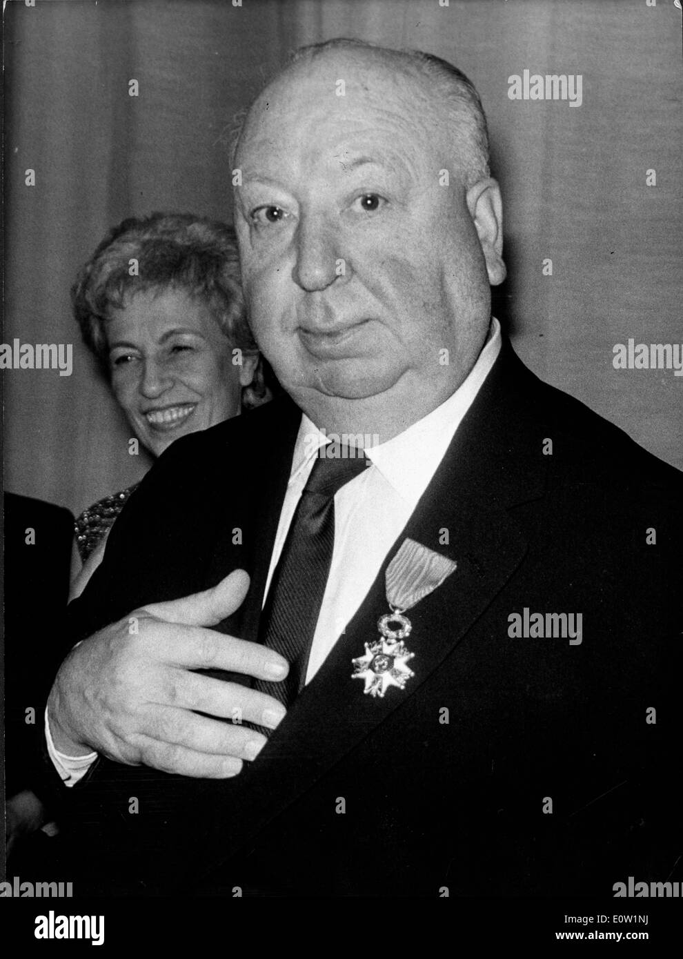 Film Director Alfred Hitchcock wearing a medal to an event Stock Photo