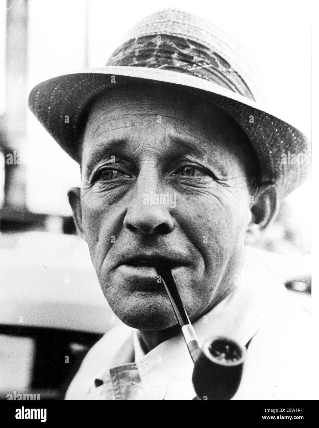 Bing Crosby with a pipe in his mouth Stock Photo