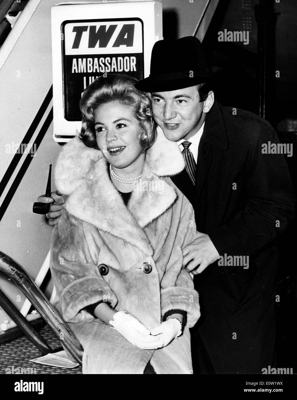 Dec. 01, 1960 - Hollywood, California, U.S. - Newlyweds BOBBY DARIN and SANDRA DEE are aglow on their arrival here last night via TWA Superjet from LA following a brief Honeymoon. Actress Sandra Dee, the blond beauty who attracted a large teen audience in the 1960s with films such as 'Gidget' and 'Tammy and the Doctor' and had a headlined marriage to pop singer Bobby Darin, died February 20, 2005 in Los Angeles. She was 62. Stock Photo