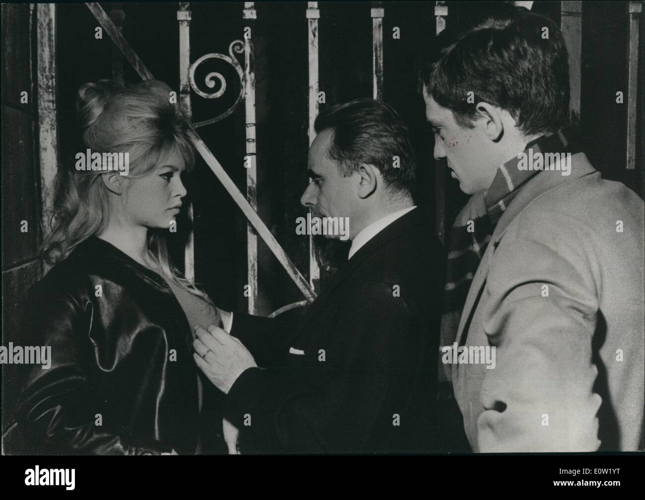 Dec. 12, 1960 - B.B Back to the Studio : Three weeks after she gave Birth to her Baby Boy Nicolas Brigitte Bardot went to her studio today. But it was only for a few hours, just for a test for a new film ''La Verite'' . The actual shooting will start only in April 20. Photo shows From left To right : Brigitte Bardot, the film director Clokzot and Jran - Paul Belmondo, one of the candidates to the star male role to be selected after tests. Stock Photo