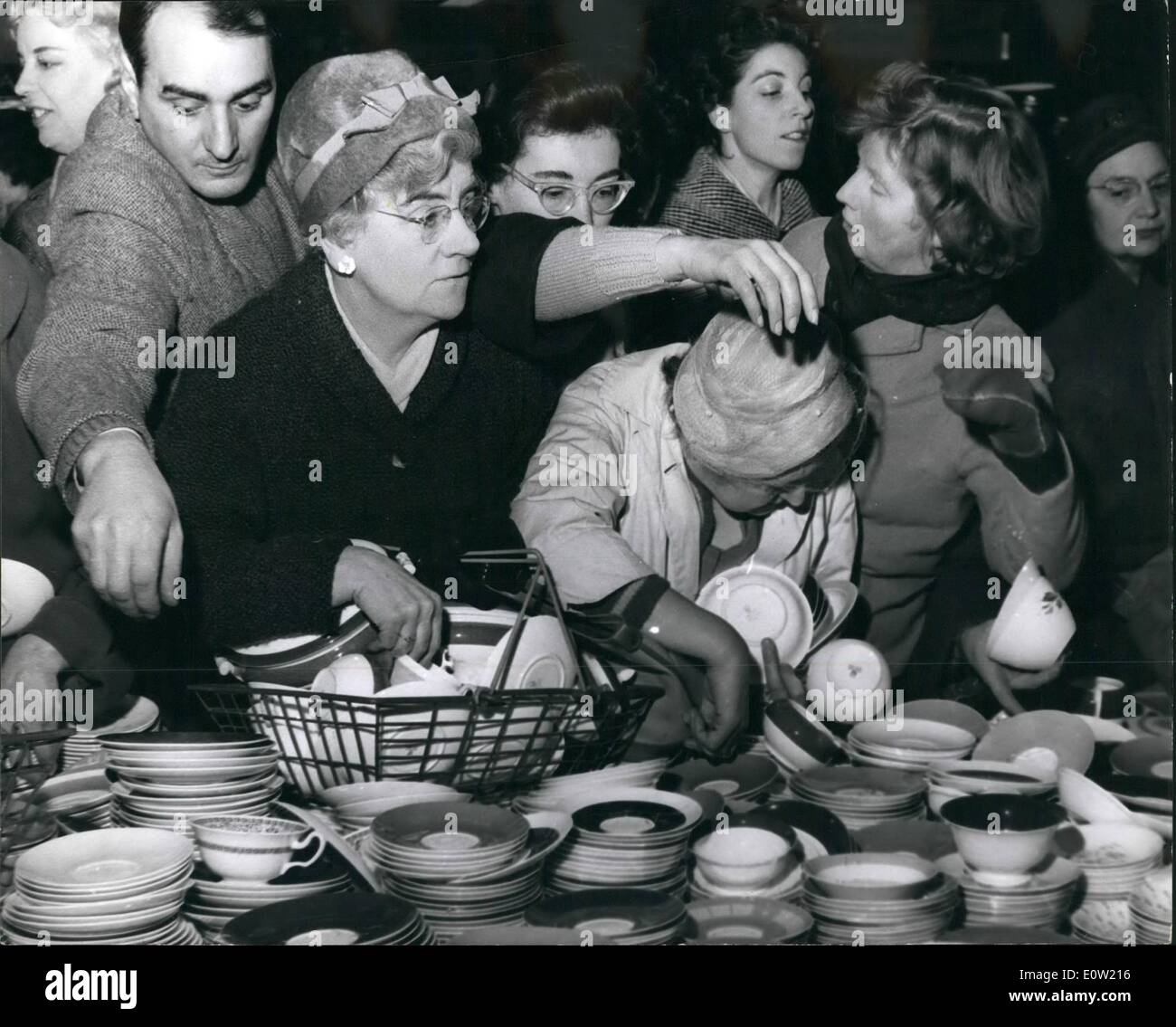 Dec. 12, 1960 - Winter sales begin at self ridges store in Oxford street. Photo shows women struggle between themselves to reach for some of the bargains at the crockery counter during the sale today. Stock Photo