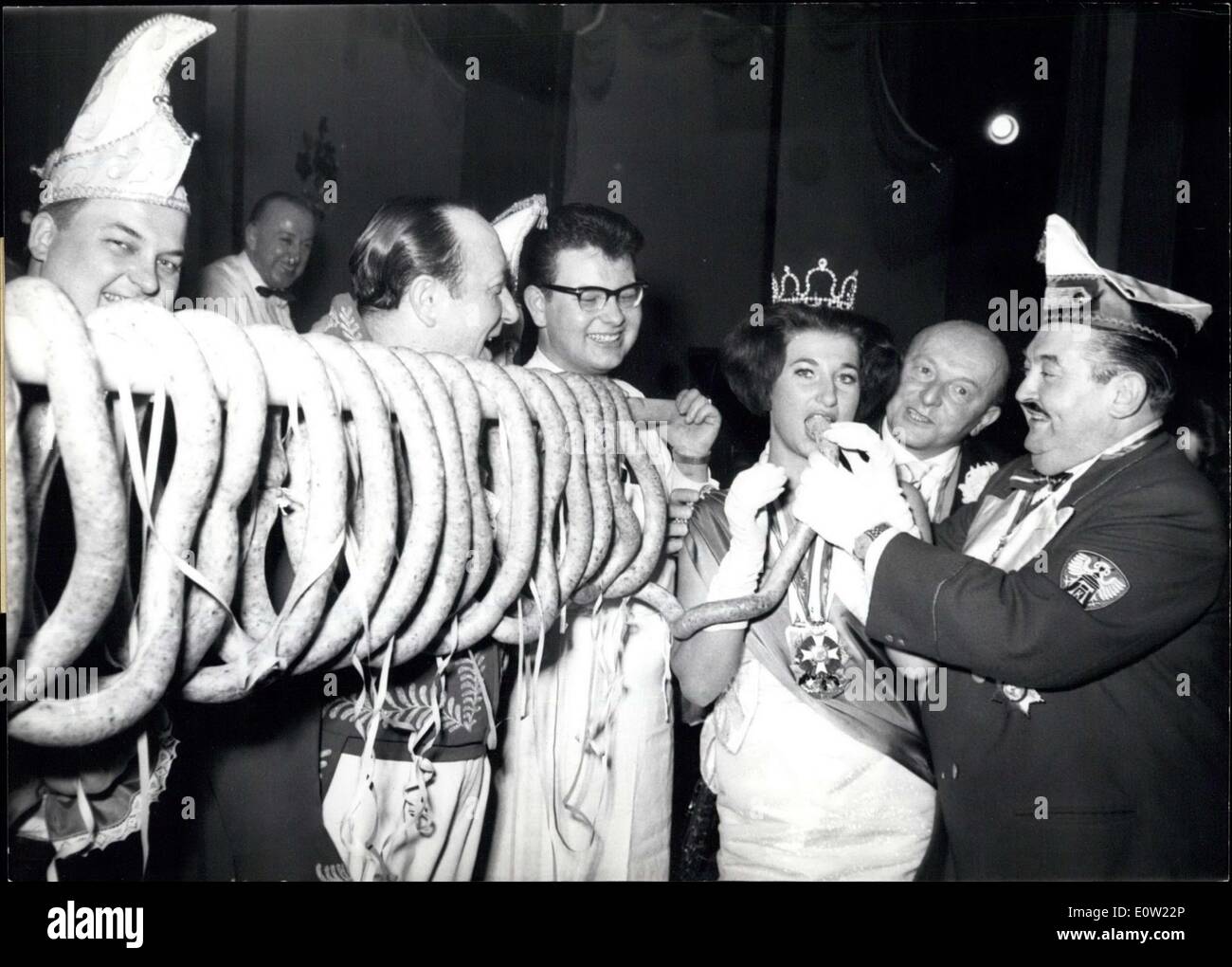 Jan. 26, 1961 - Good Appetite Till Ash- Wednesday: The Butchers in Nurnberg presented to ''Her Loveliness'' Maria , their princess of carnival, a 15 m long Sausage at her first grand ball. It Shall help her to get over the coming exerting weeks. Stock Photo