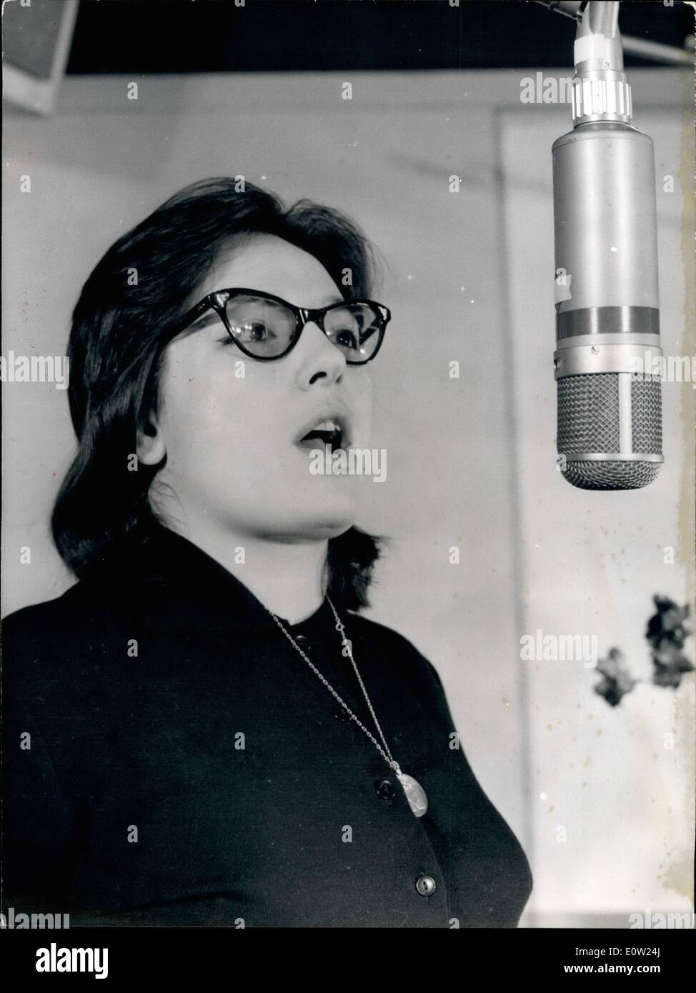 Feb. 02, 1961 - Greek Singer Makes a Hit.: Nana Mouskouri, the famous Greek Singer who first achieved fame singing ''The Children of Piraeus'' is now in Paris. Photo shows Nana Mouskouri singing for the first time a song a French which made a hit in Paris. Stock Photo