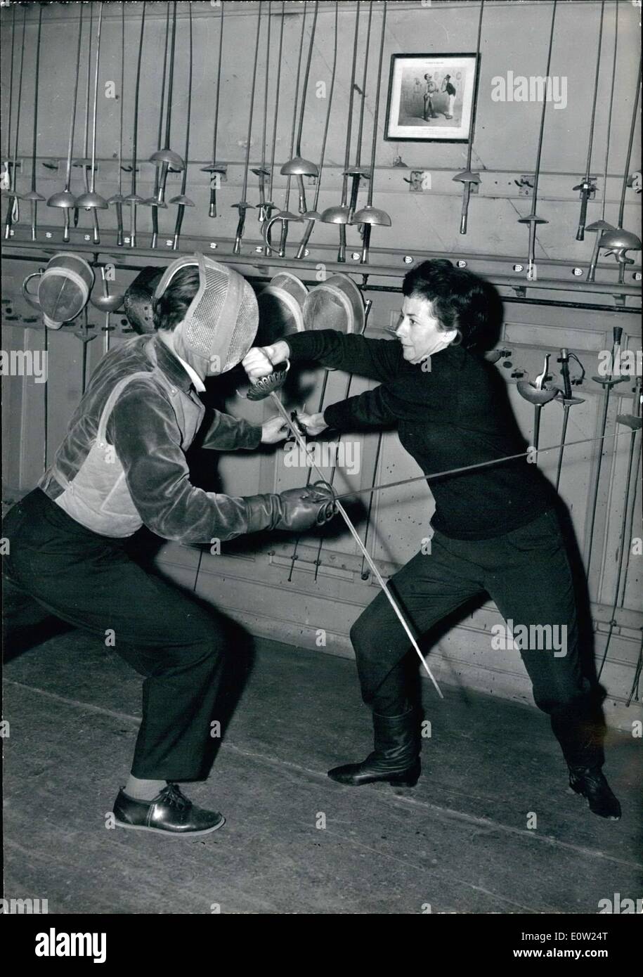 Feb. 02, 1961 - Famous Actress Taken Up Fencing: Suzanne Flon, the Famous French actress, has been taking fencing lessons for the next role in the ''Kings' Night'' to be staged at Vieux-Colombiers. Phot Shows Suzanne Colombier facing with her trainer. Stock Photo