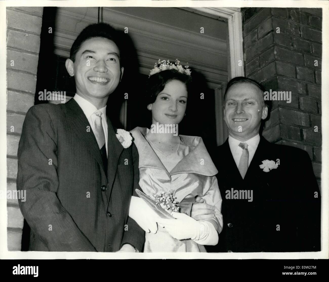 Dec. 12, 1960 - Yehudi Menuhin's Daughter Weds Chinese Pianist- The wedding took place this morning at Hampstead Register Office of twenty year old Zamira Menuhin daughter of world famous violinist Yehudi Menuhin to twenty six year old Mr. Fou Ts'ong who fled from Communist China two years ago to the West - to gain fame as a pianist. Keystone Photo Shows:- Yehudi Menuhin with the bride and bridegroom after the wedding this morning. JSS/KEYSTONE EM/725124 Stock Photo