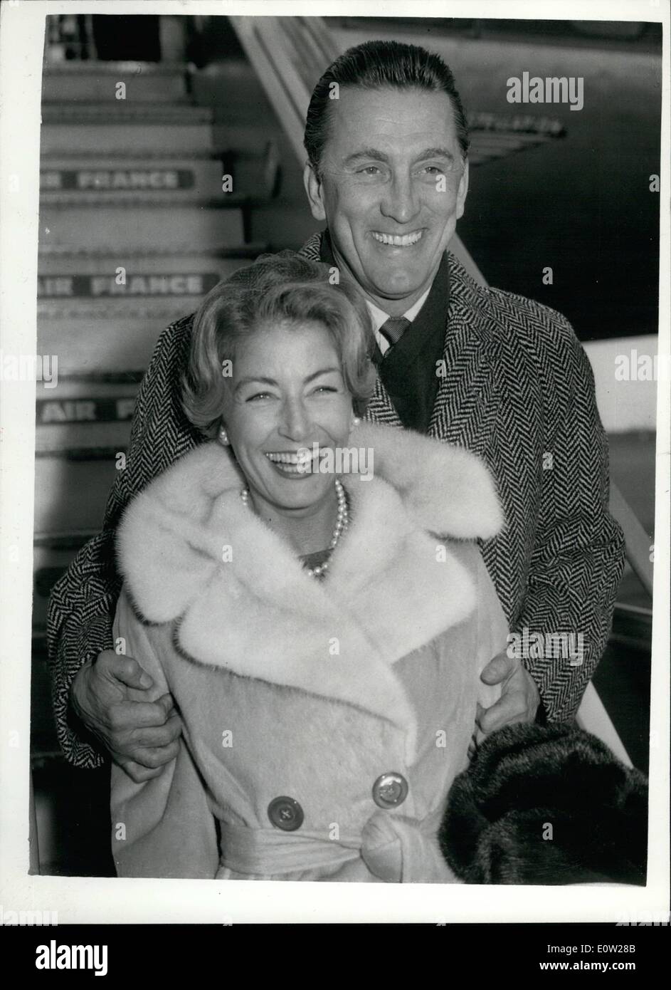 Dec. 12, 1960 - Kirk Douglas and wife arrive for film premiere : Film star Kirk Douglas and his wife arrived a London airport this afternoon. They are here for the premiere of the new film ''Spartacus''. Photo shows Kirk Douglas and his wife on arrival at London airport this afternoon. Stock Photo