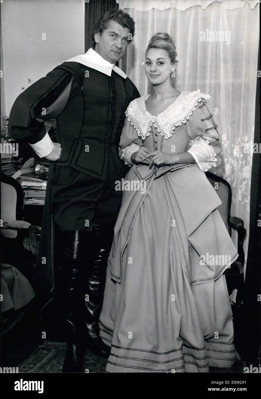 Dec. 12, 1960 - Jean Marais in new cloak and dagger film: Jean Marais who has been specializing in cloak and dagger films lately is now starring in ''Capitaine Fracasse'' based on the famous novel by Theophile Gautier. Jean Marais and his pretty partner Genevieve Grad trying on the costumes they wear in the film. Stock Photo