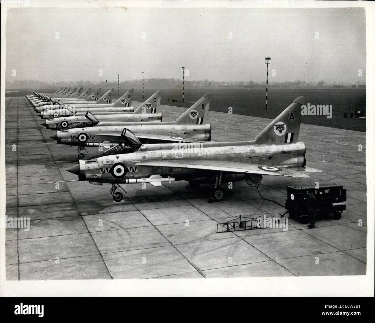 Feb. 02, 1961 - English Elegtrez ''Lightnings'' In Service: Rocket-firing 1,500 m.p.h. English Electric Lightning all-weather fighters lined up on the tarmac at the R.A.F. station, Coltishall, yesterday.. No. 74 Squadron at Coltishall is the fist to be equipped with this supersonic aircraft, which can fly at twice the speed of soundin level flight.. Normally armed with two 30mm. Aden guns and two De Havilland Firestreaks air-to-air missiles, the lightning can alternatively carry four guns or 48 . in Rockets plus to guns. The Lightning can fly at above 6,000 ft. Stock Photo