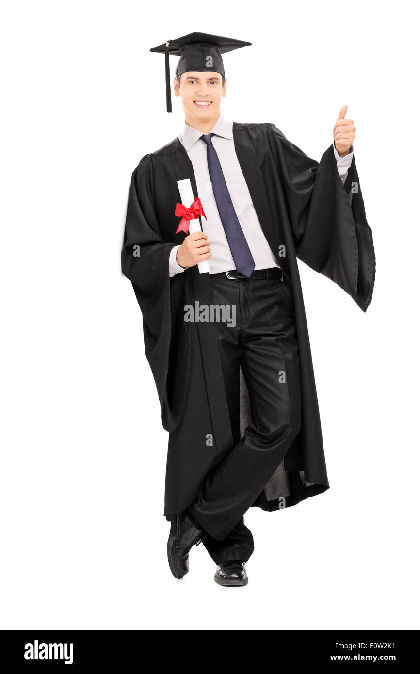 Male graduate holding diploma and giving thumb up Stock Photo