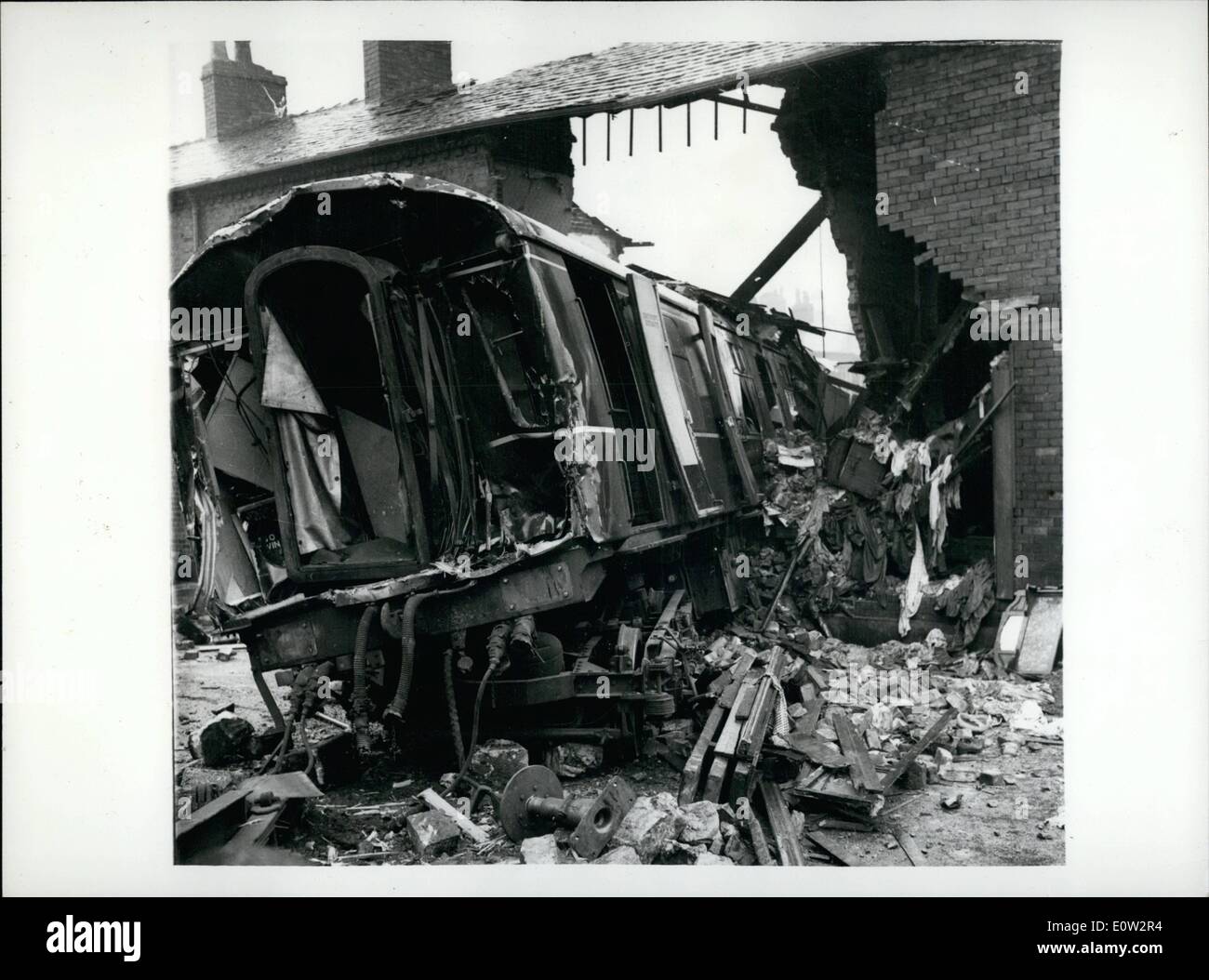 Feb. 02, 1961 - Runaway train rams houses eight people had miraculous escapes.: Eight people had miraculous escaped from death when a 120-ton diesel train crashed through station buffers and a stone wall to plough across a road and through a row of terraced houses at 35-40 mph. near Oldham, Lanos, yesterday. Driver Harry Pearse sounded his horn for a quarter of a mile as the train hurtled out of control down a gradient into Royton Station. Then, 30 yards from the buffers, he flung himself on to the station platform Stock Photo