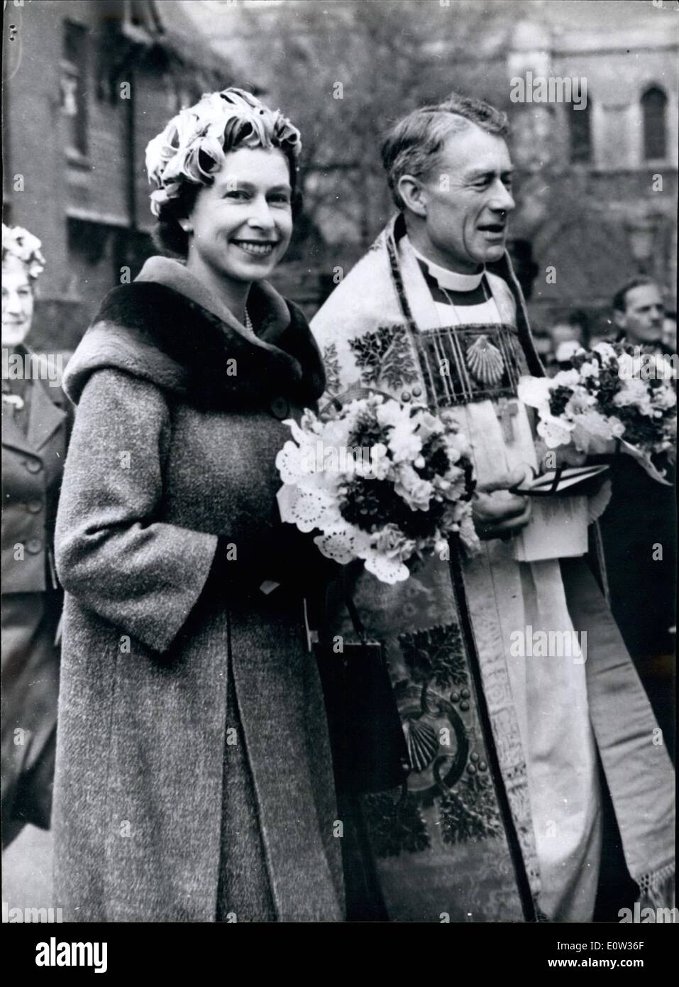 Mar. 03, 1961 - The Queen at The Royal Maundy money ceremony at Rochester Cathedral: H.M. the Queen, distributed the traditional Maundy Money when she visited Rochester Cathedral, Kent, today. Thirty-five elderly men and thirty five elderly women (one for each year of the Queen's age) reached 35 penoe, in specially minted silver fourpenoes threeponeoes, twopenoes and penoe. The distribution in the Royal Maundy gifts, an ancient Royal tradition, perpetuates Our Lord's washing the feet of his Disciples before the Last Supper. Photo shows H.M. the Queen and the Dean of Rochester, the Rt. Rev Stock Photo