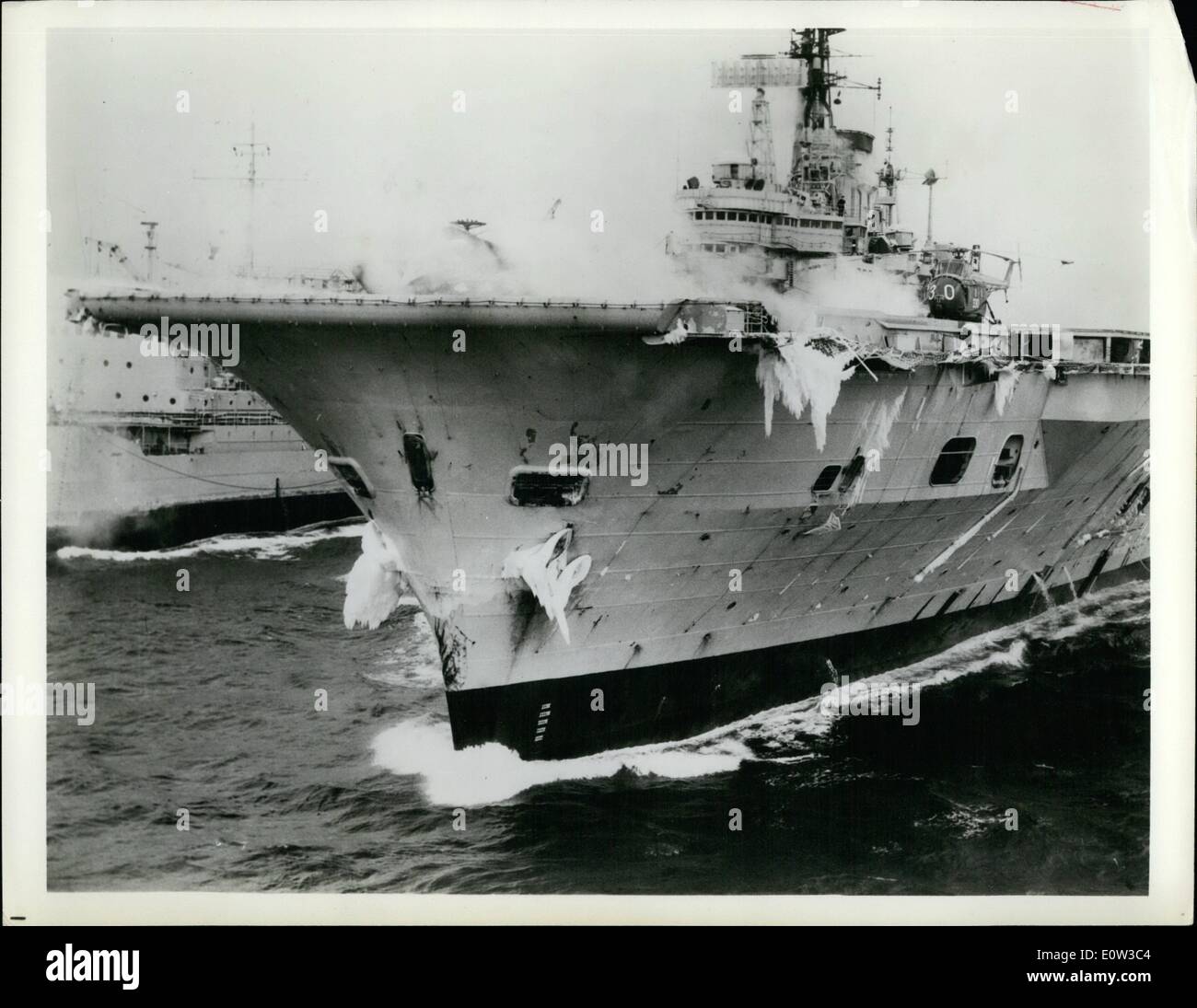 Mar. 03, 1961 - Icy Ark: Storm-Tossed Tanker: H.N.S. Ark Royal, 50,000 tons, Britain's largest aircraft carrier, carries out cold-weather flying trials in the Davis Strait, West of Greenland, following which she visited the United States (New York City) on her way back to Britain. Pictured is ice decorating her superstructure while steam from her catapult and the exhausts of her jet aircraft produce a fog on deck. Stock Photo