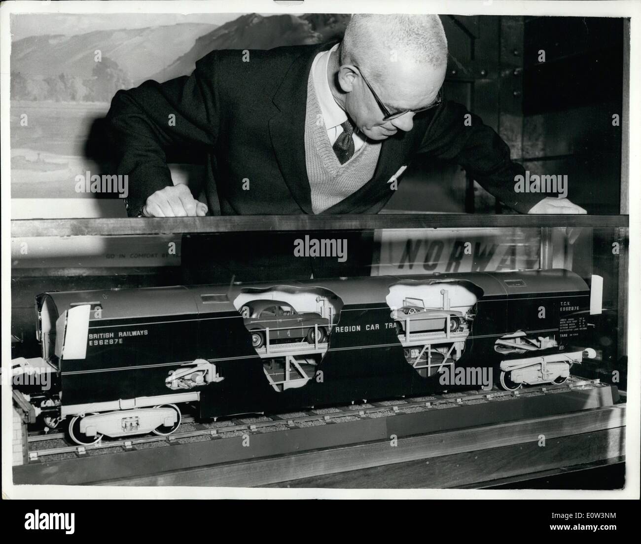 Mar. 03, 1961 - New Car-Carrying Railway Coach For Use On London - Scotland Run: A cutaway model of a new car carrying Railway Coach expected to be in service between London and Scotland this summer. Here a Railway employes is seen looking at the model's layout - on show at the car-loading by King's Cross Station. Each Coach developed by eastern Region of British Railways - is divided into upper and lower tiers and carries so cars. The carriages now in use have no upper tier - and carry only three cars. The New carriages are expected to be in use between London and Scotland this summer. Stock Photo